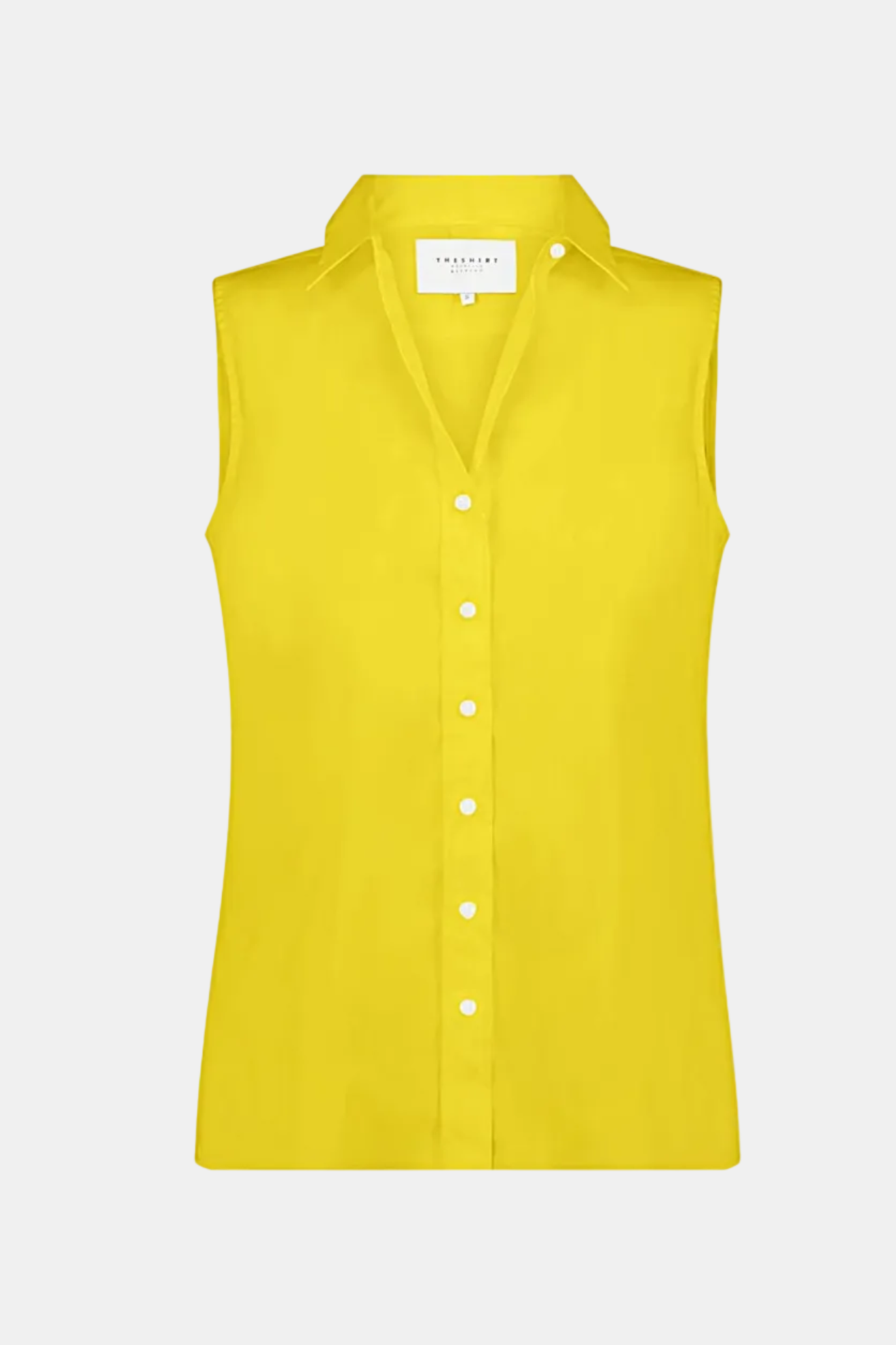 Yellow sleeveless blouse on a white background