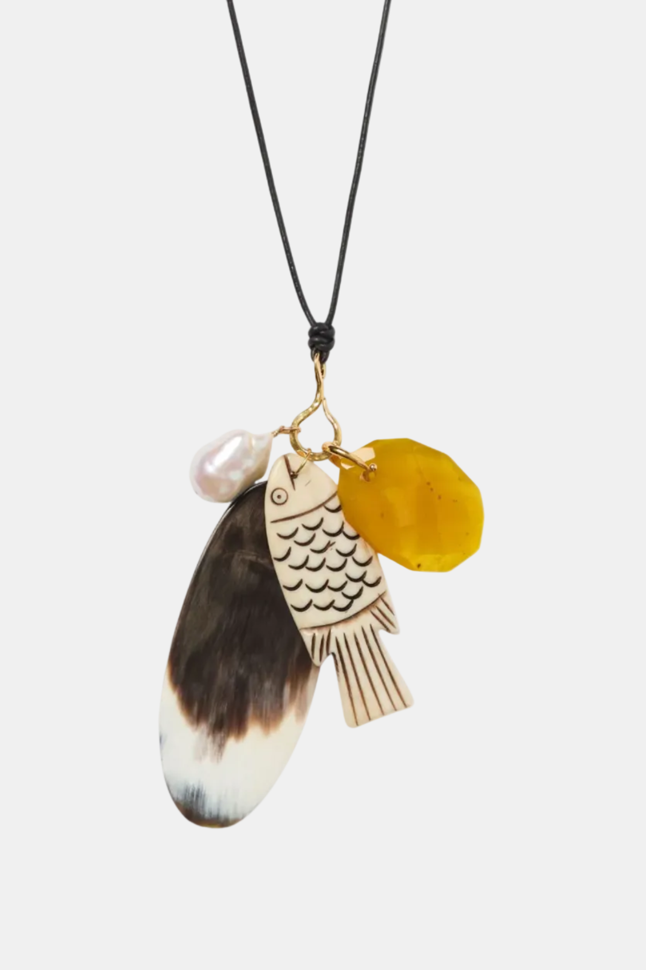 Necklace with a fish-shaped pendant, pearl, and yellow disc on a white background
