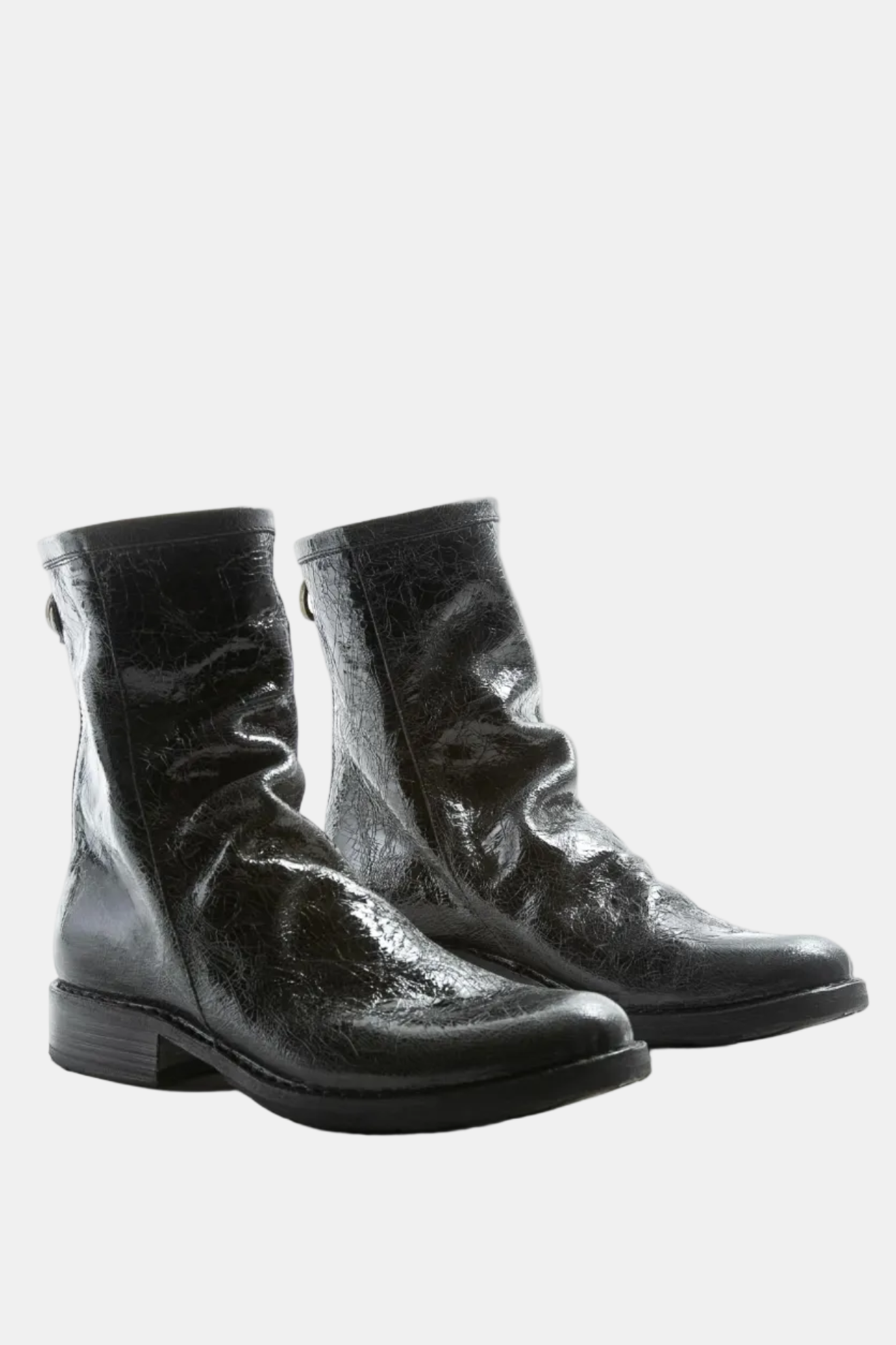 Pair of black leather ankle boots on a white background