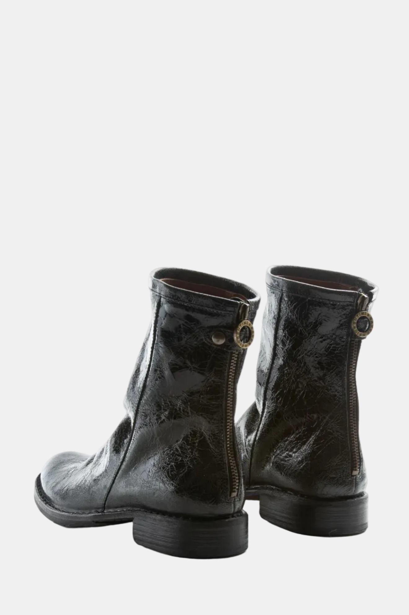 Black leather ankle boots on a white background