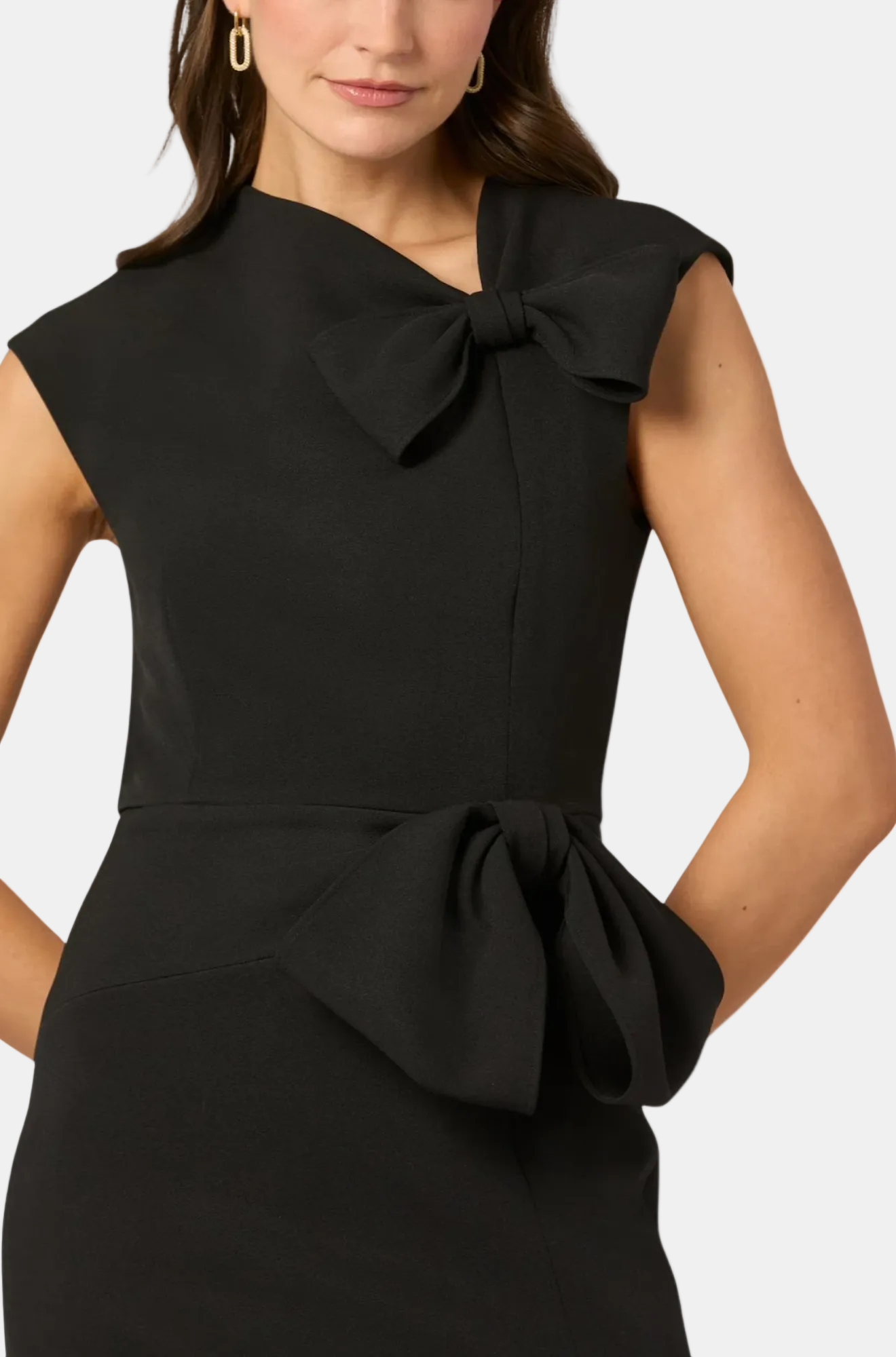 Black dress with a large bow detail on a white background