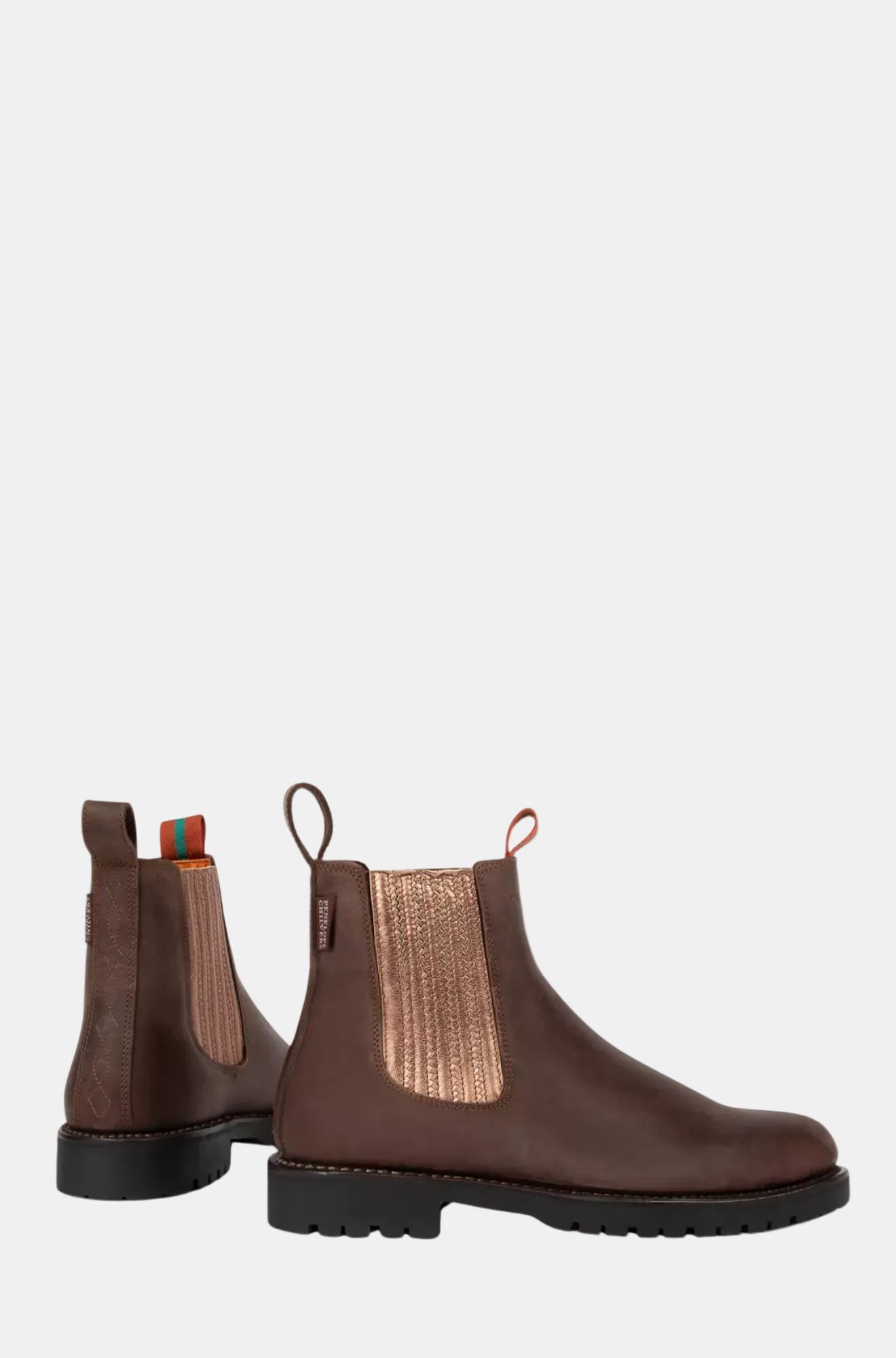 Pair of brown leather Chelsea boots on a white background