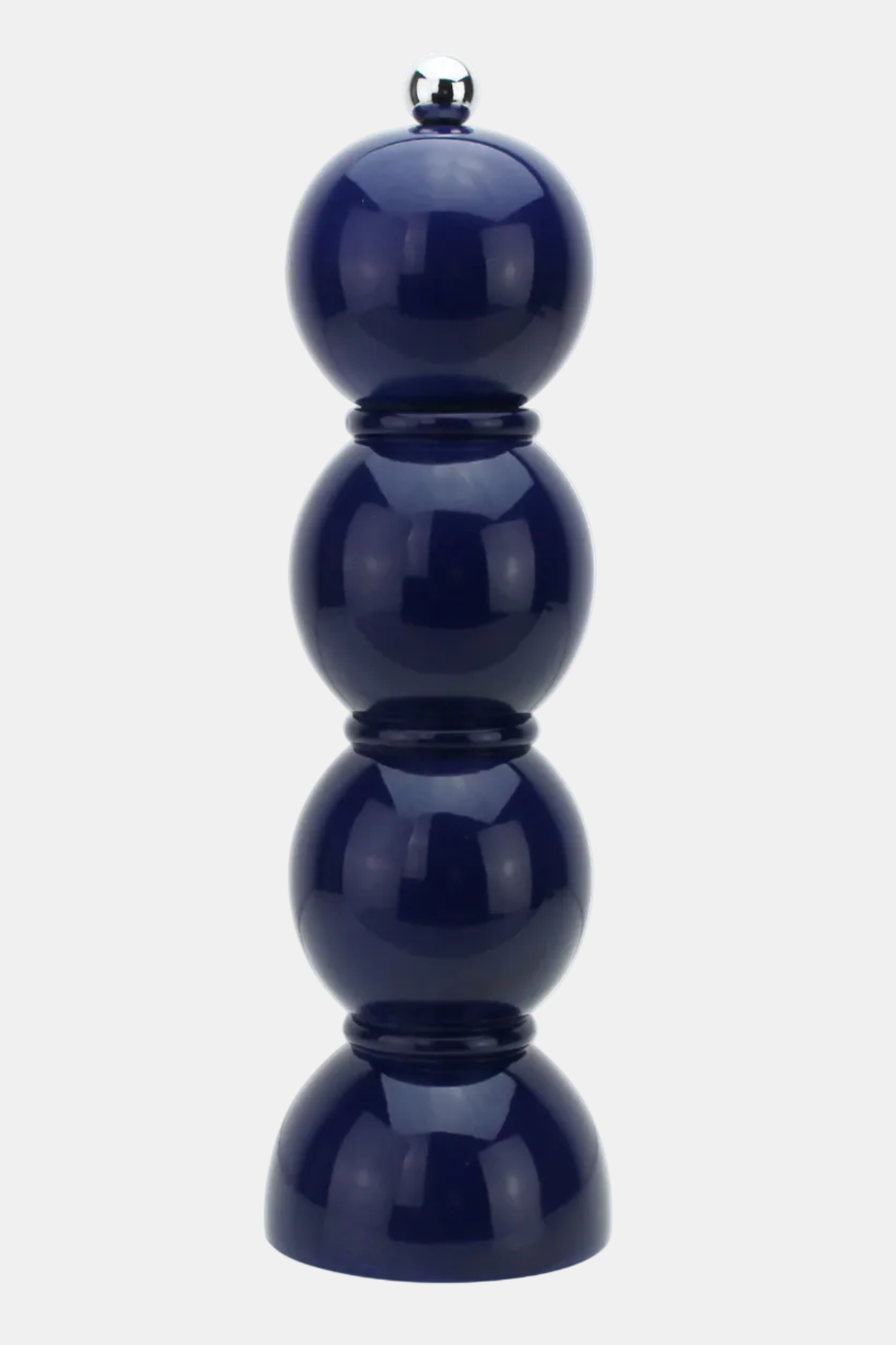 A glossy dark blue ceramic pepper mill featuring a stacked design of four rounded spheres, set against a plain light gray background.