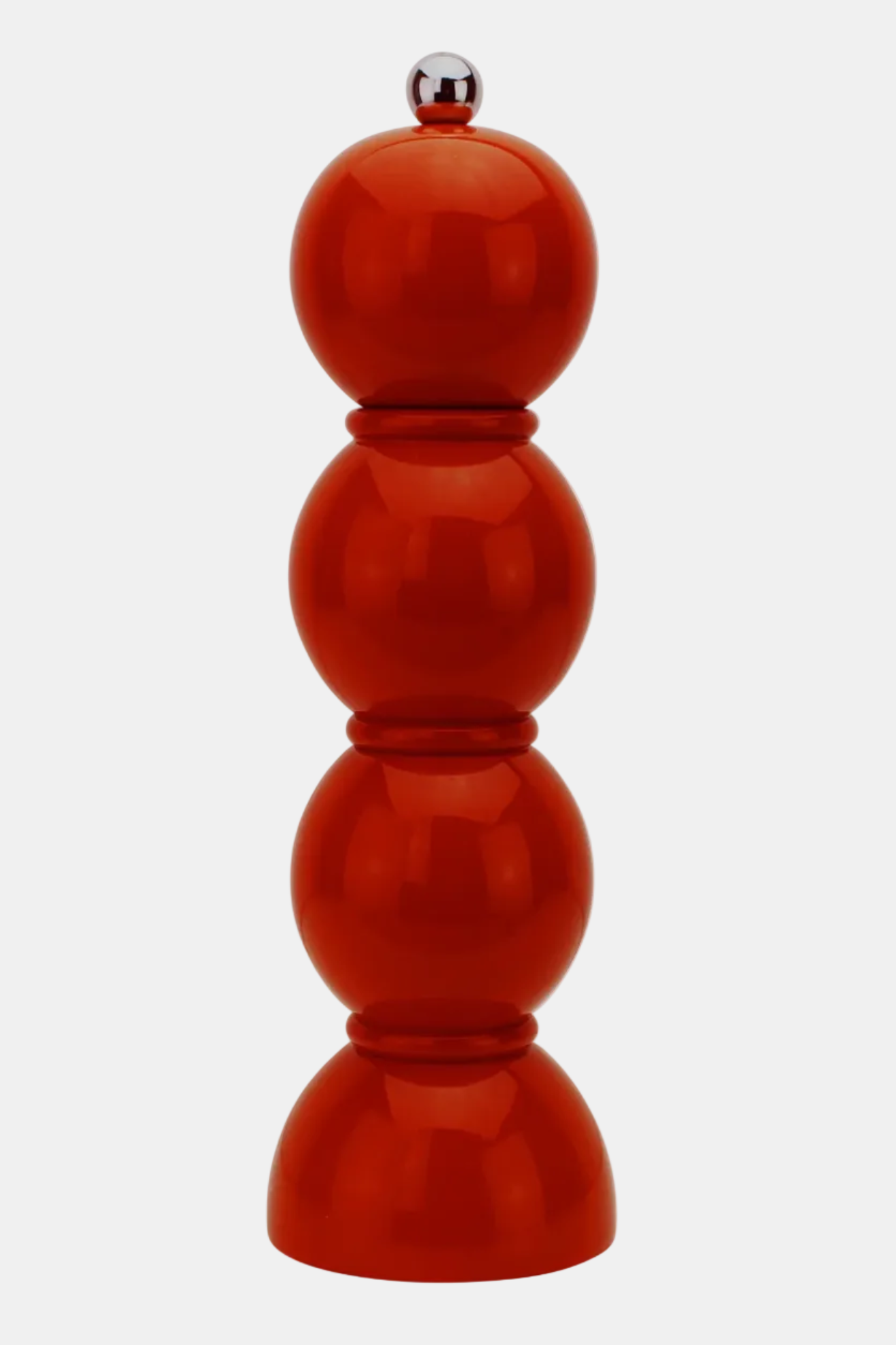 A glossy red pepper mill with a stacked, rounded design and a small silver metal knob on top, set against a plain light gray background.