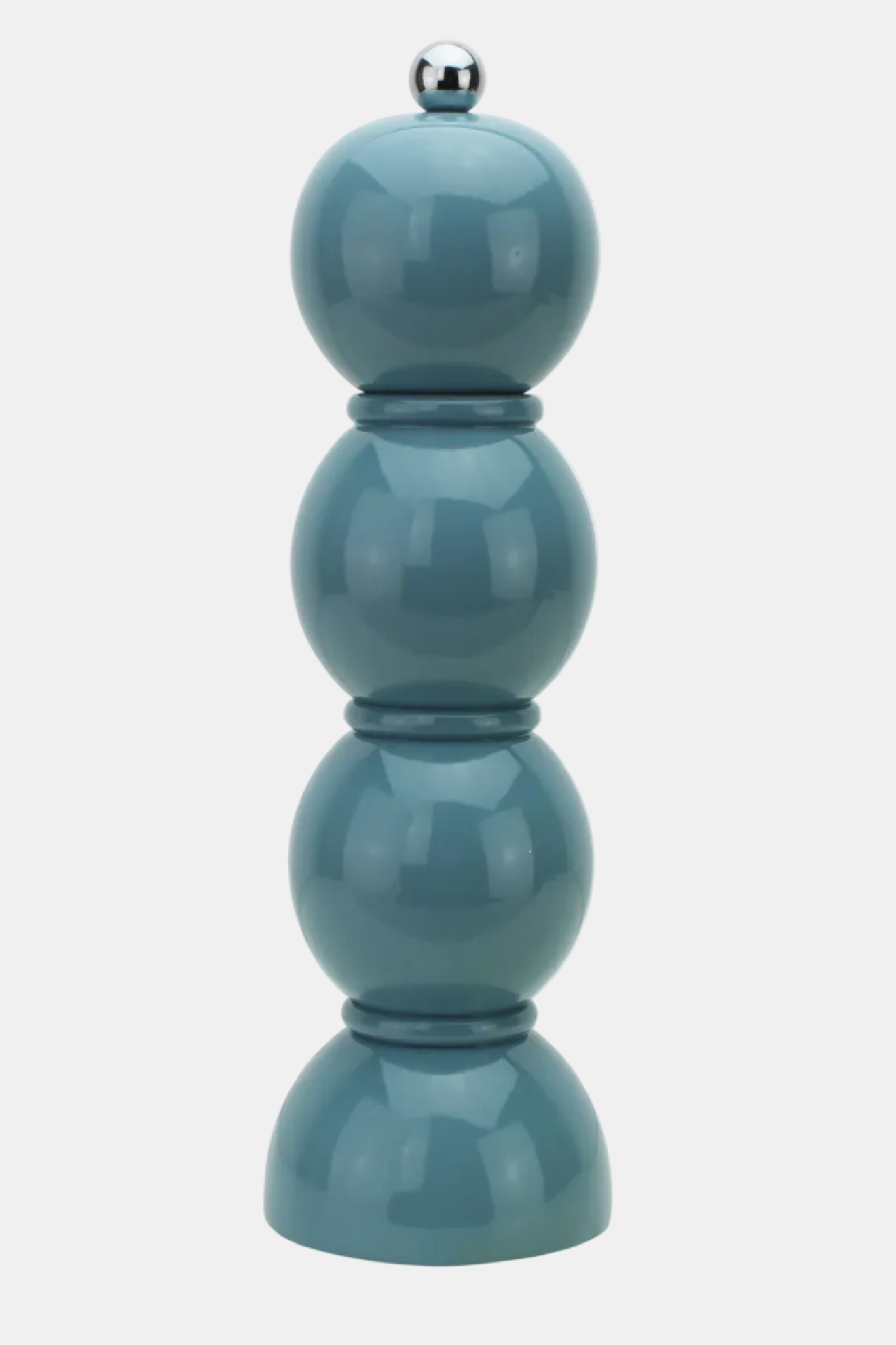 A tall, glossy ceramic pepper mill featuring four stacked rounded tiers in a muted teal blue color, topped with a small metallic silver knob, set against a plain light gray background.