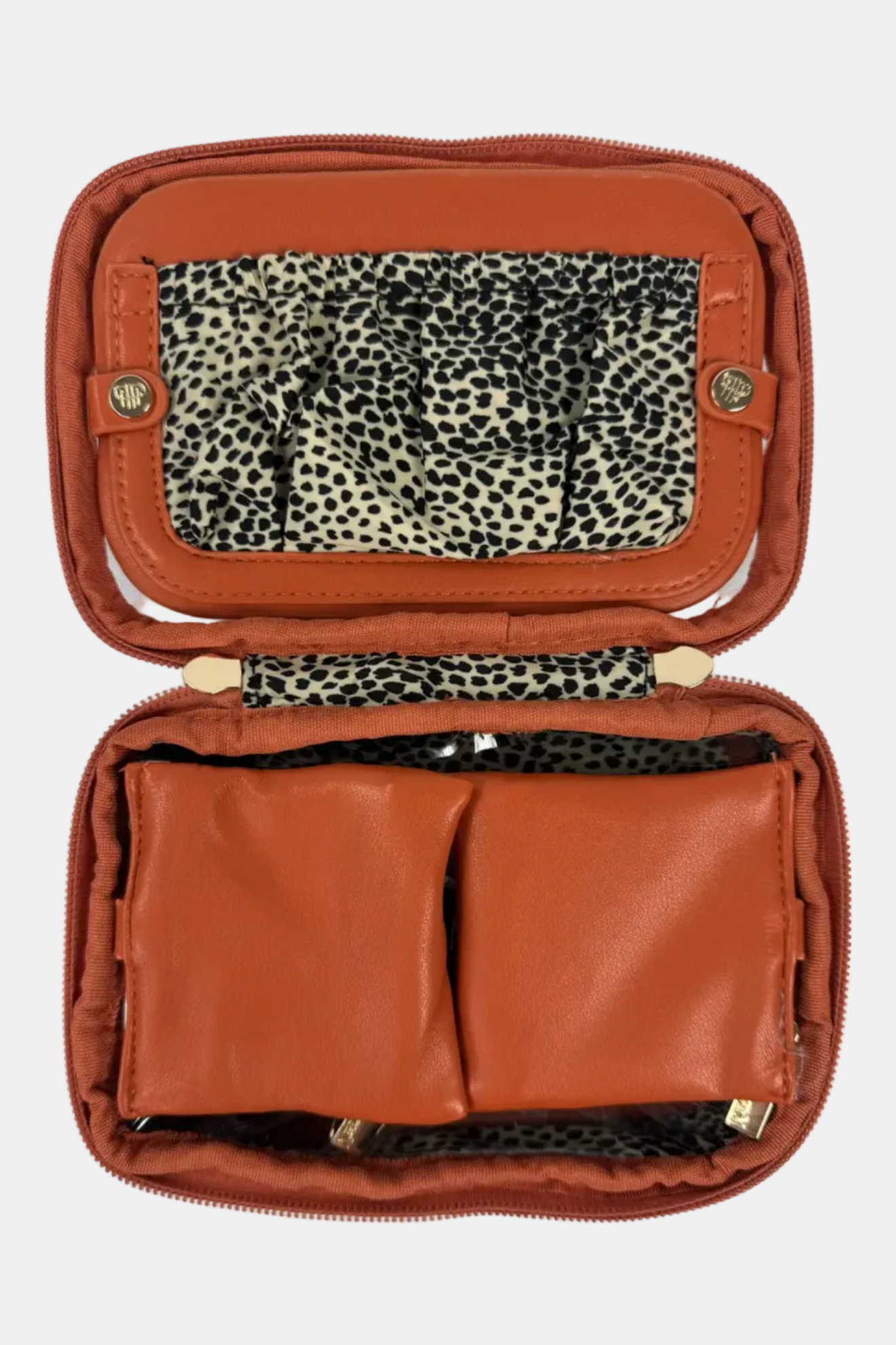 Open brown leather case with leopard print interior on a white background