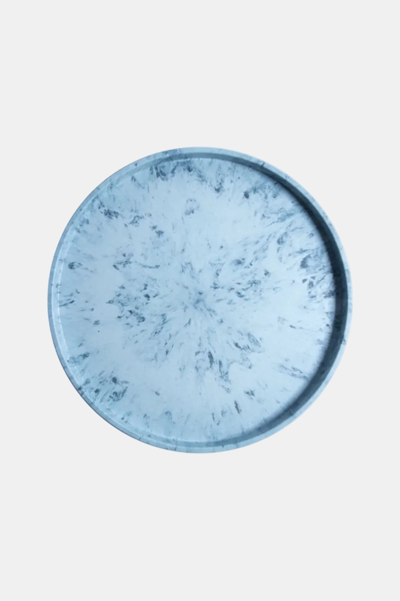 Round blue ceramic plate on a white background