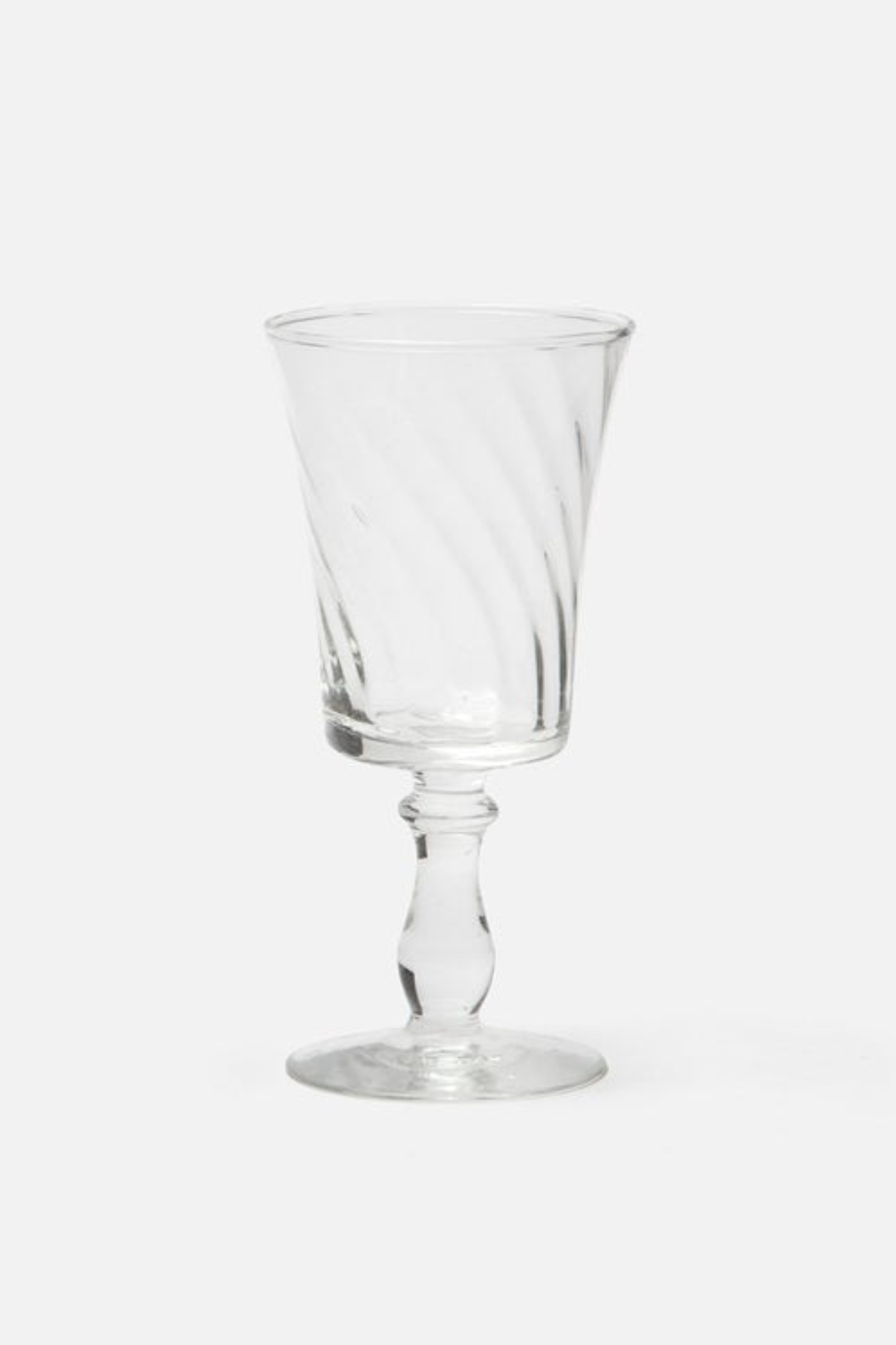 Clear glass with a stem on a white background