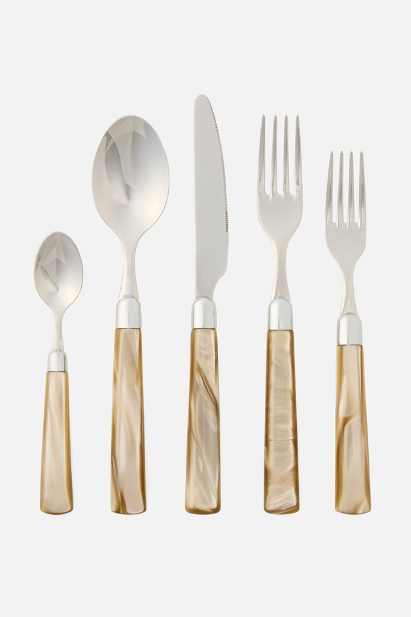 Set of silver cutlery with beige handles on a white background