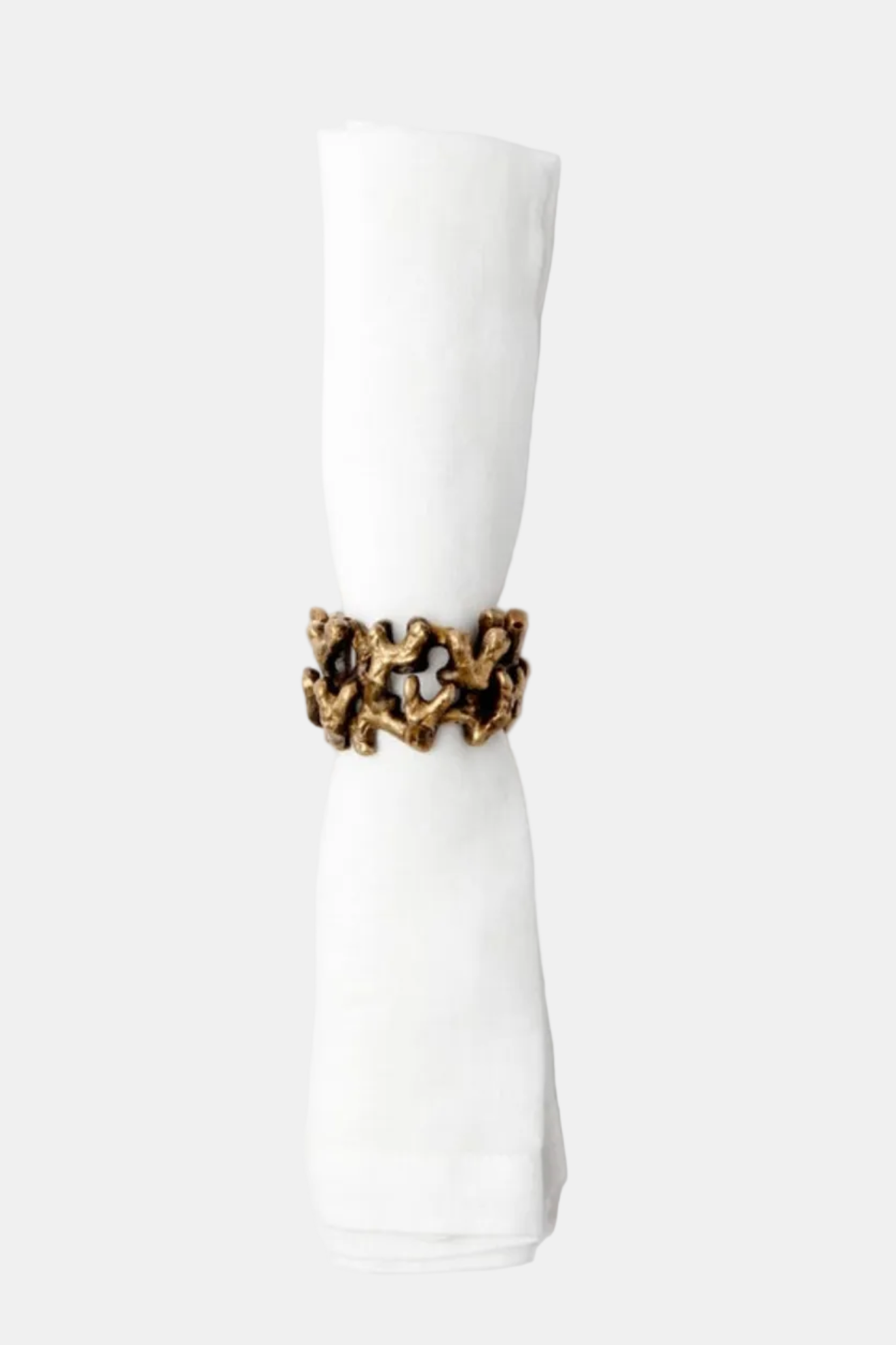 Gold ring with a textured design on a white background