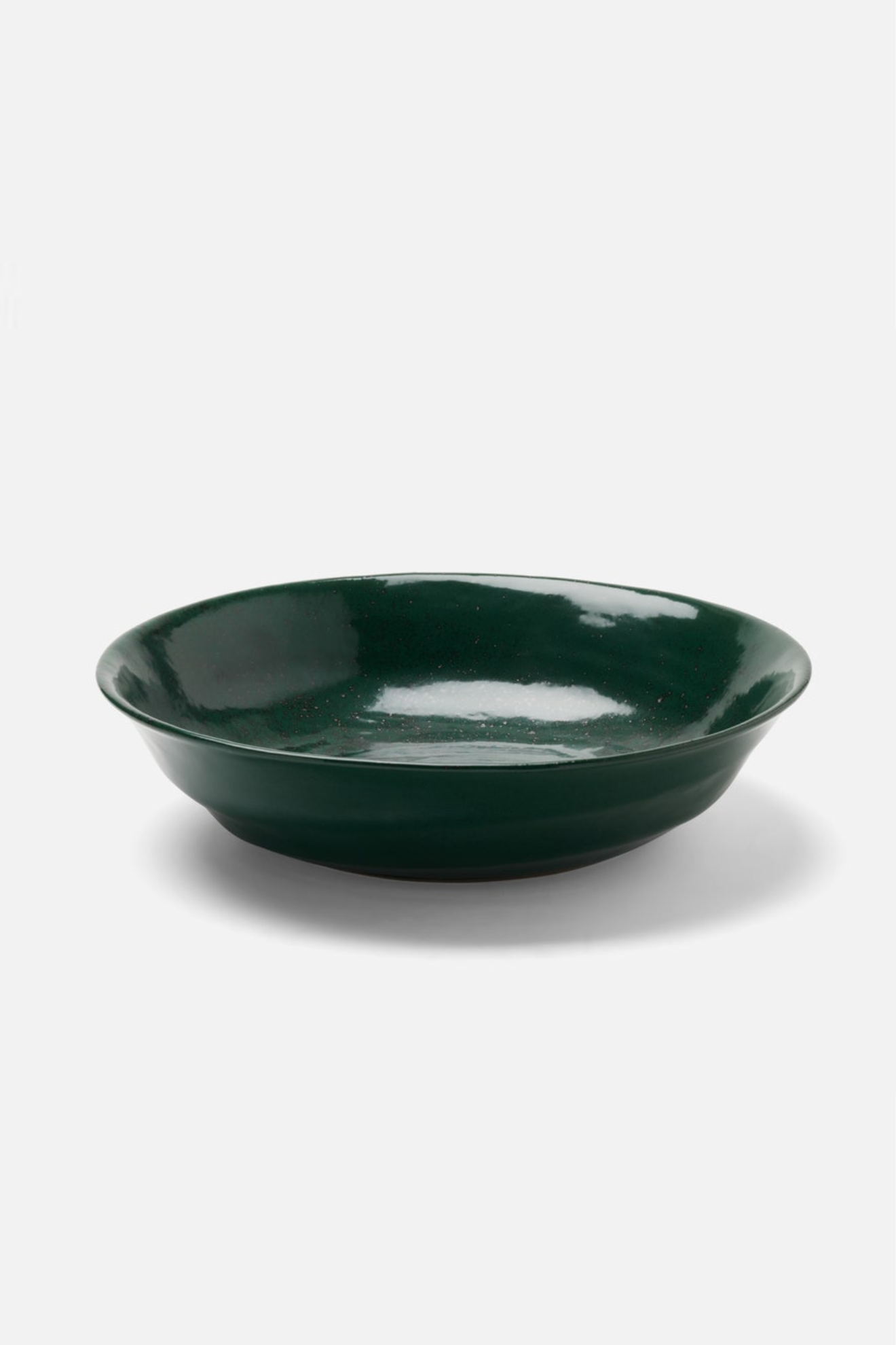Green ceramic bowl on a white background