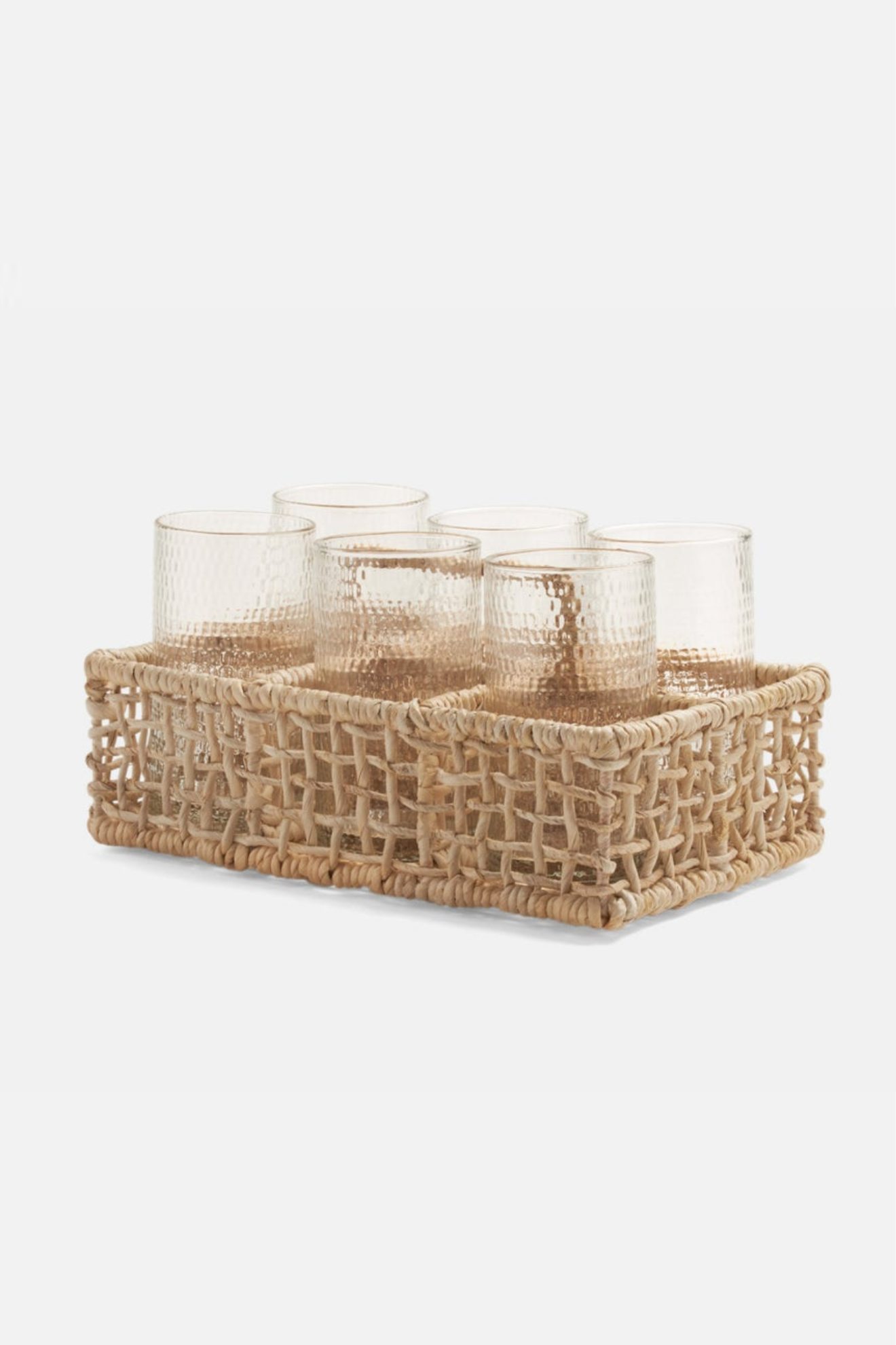 Woven basket with glass containers on a white background