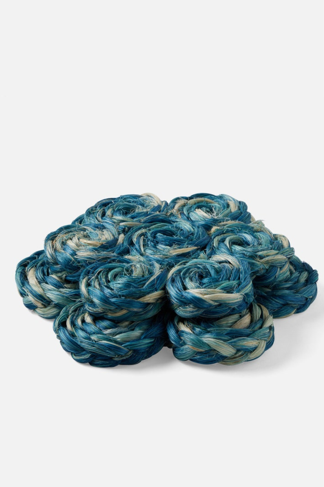 Blue and white yarn skeins on a white background
