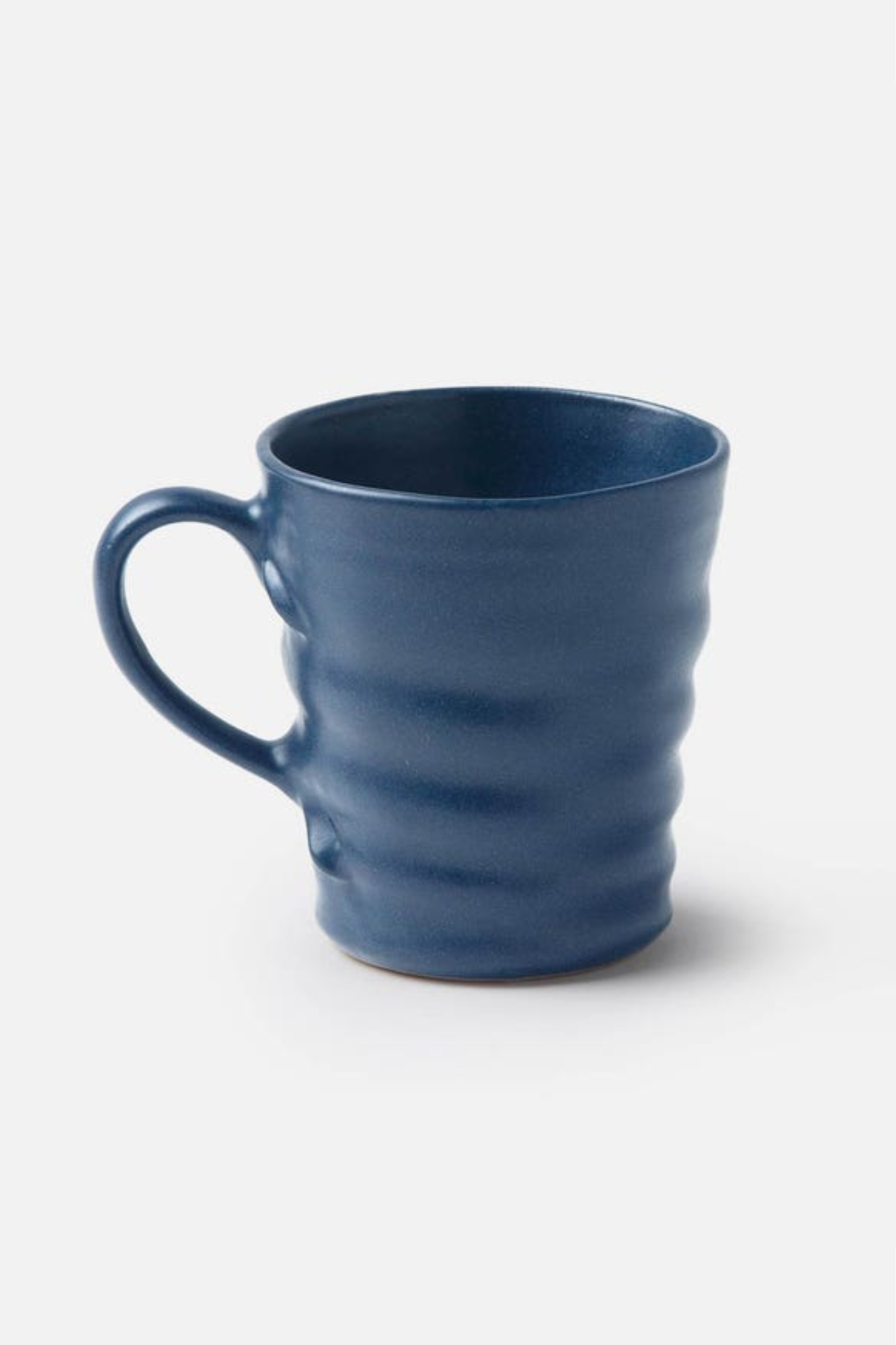 Blue ceramic mug on a white background