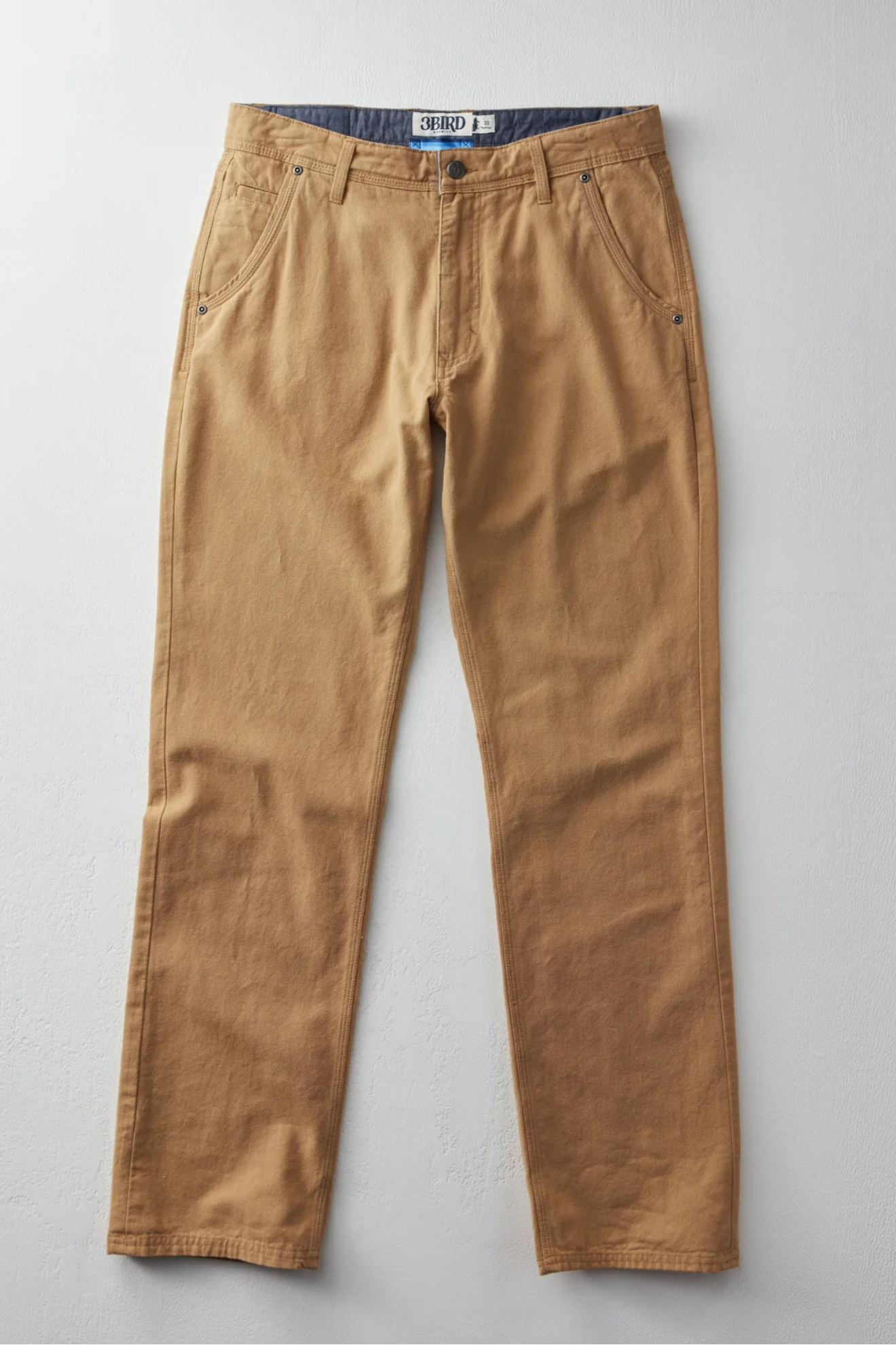 Brown pants on a light gray background