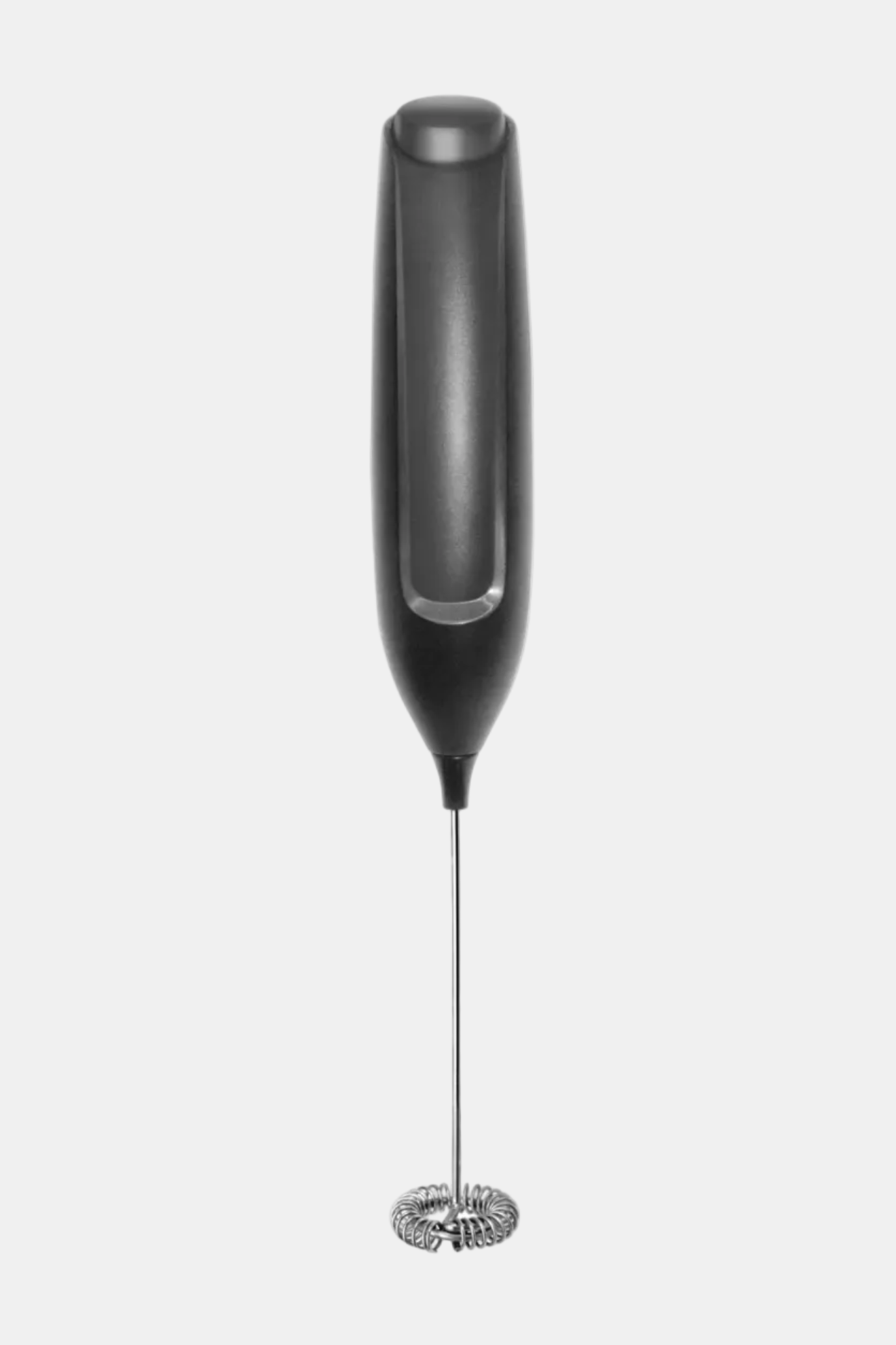 Black handheld milk frother on a white background