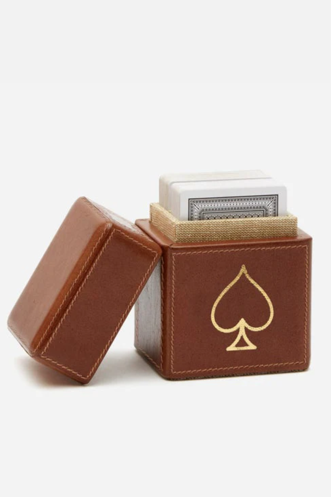 Brown leather card holder with gold spade symbol containing a deck of cards on a white background