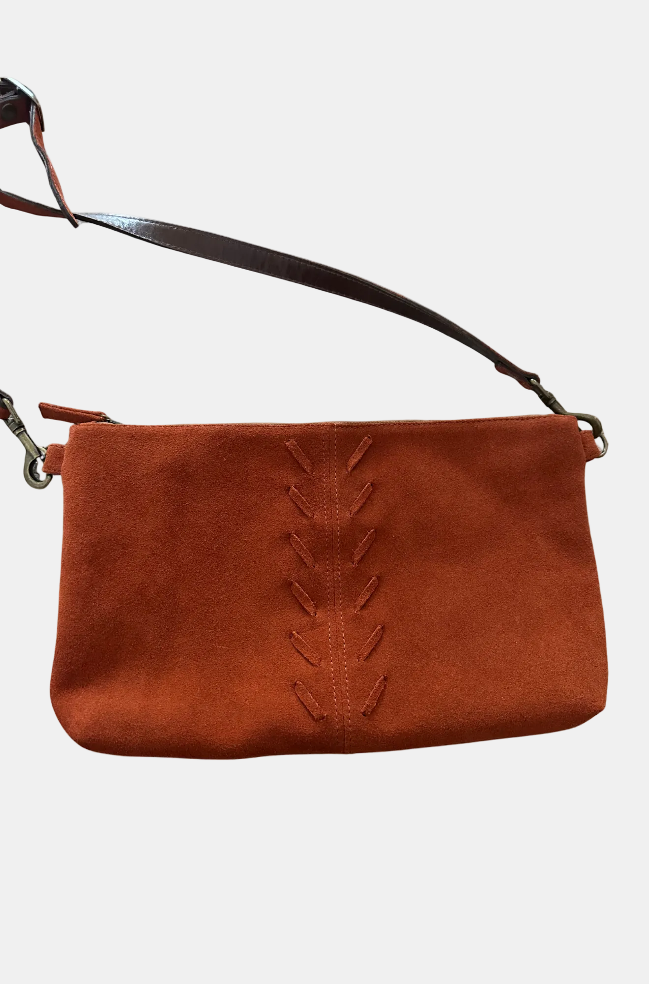 Brown suede handbag with decorative stitching on a white background