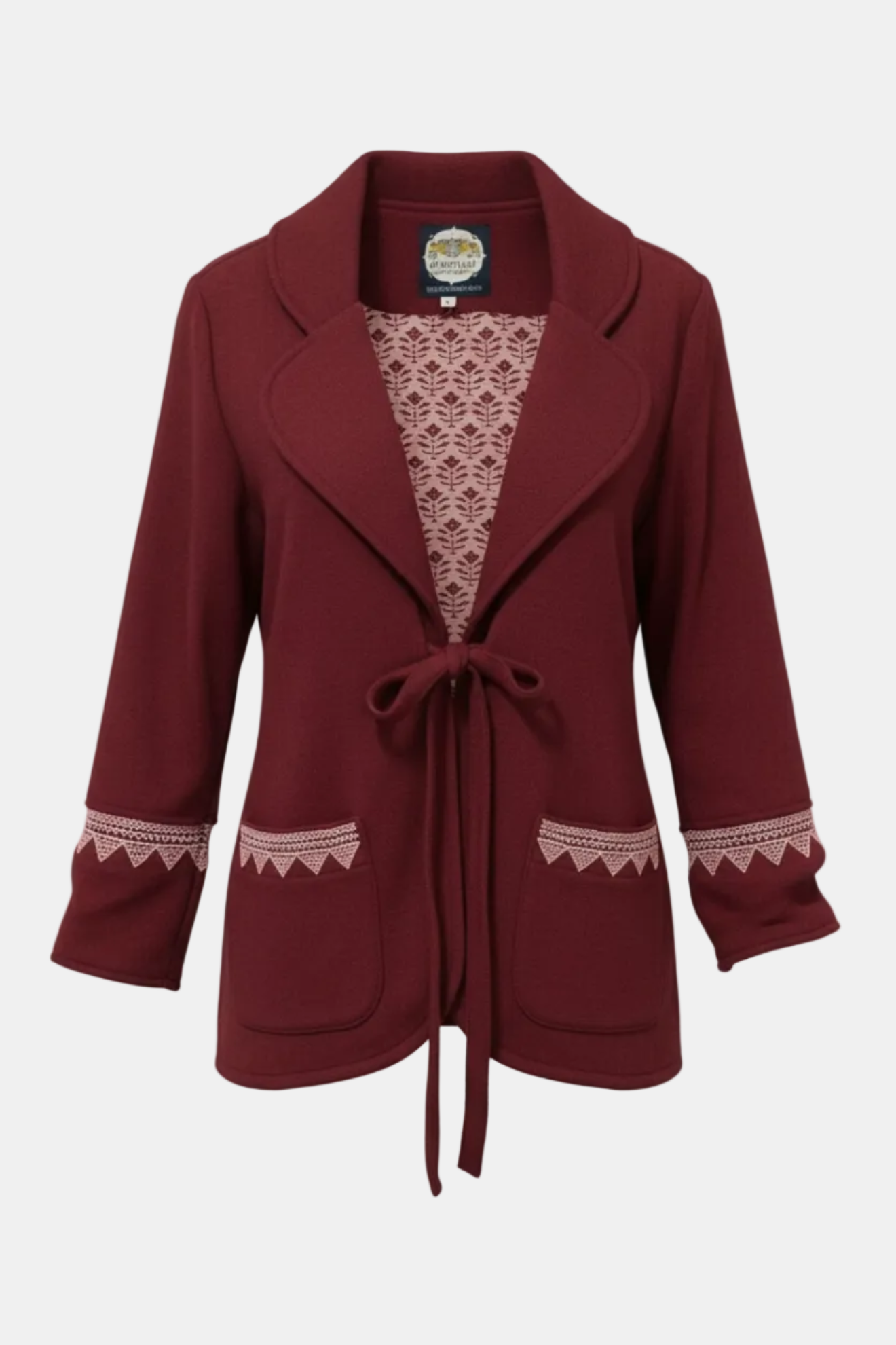 Maroon coat with lace detailing on a white background