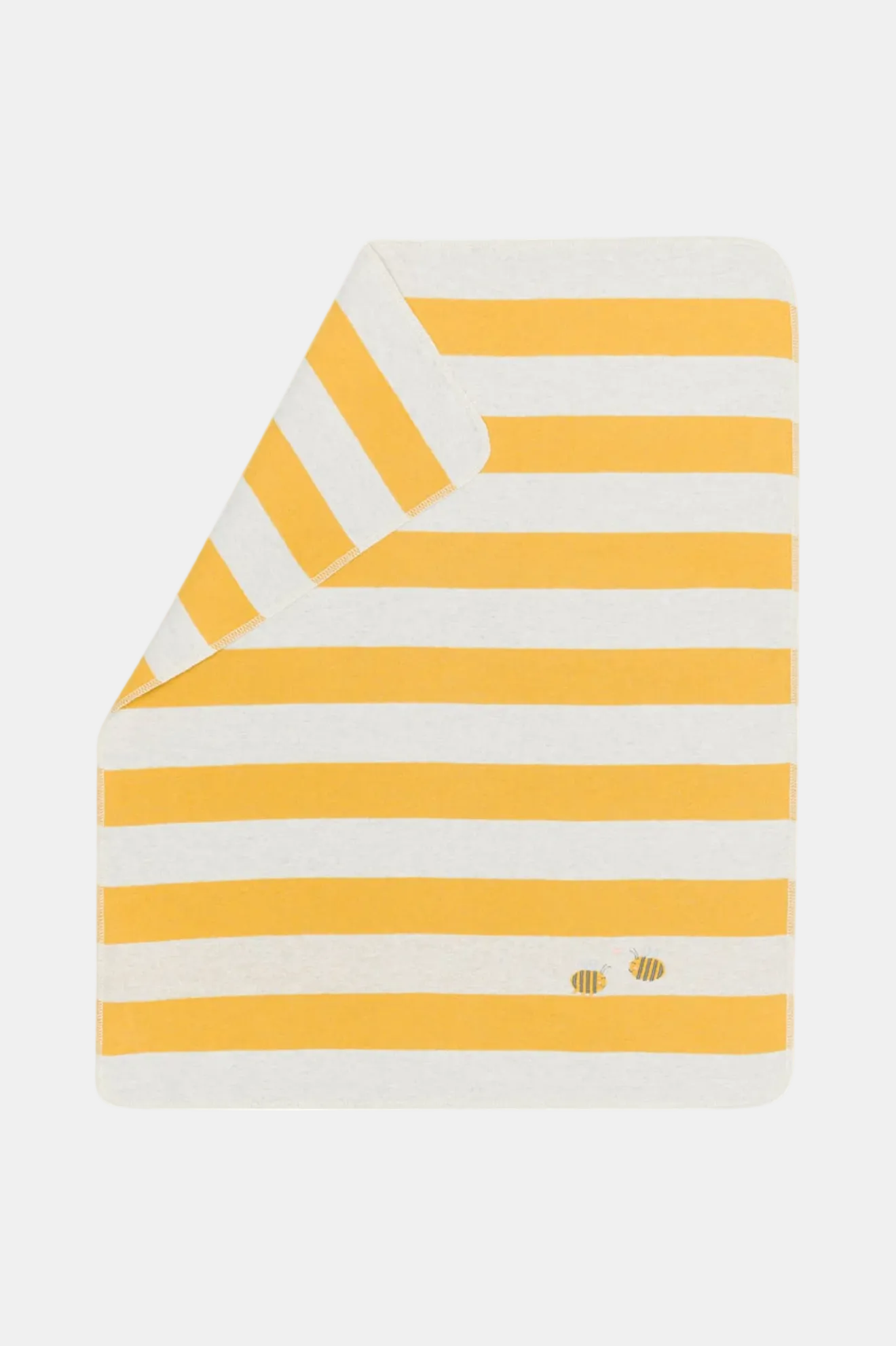 Yellow and white striped blanket on a white background