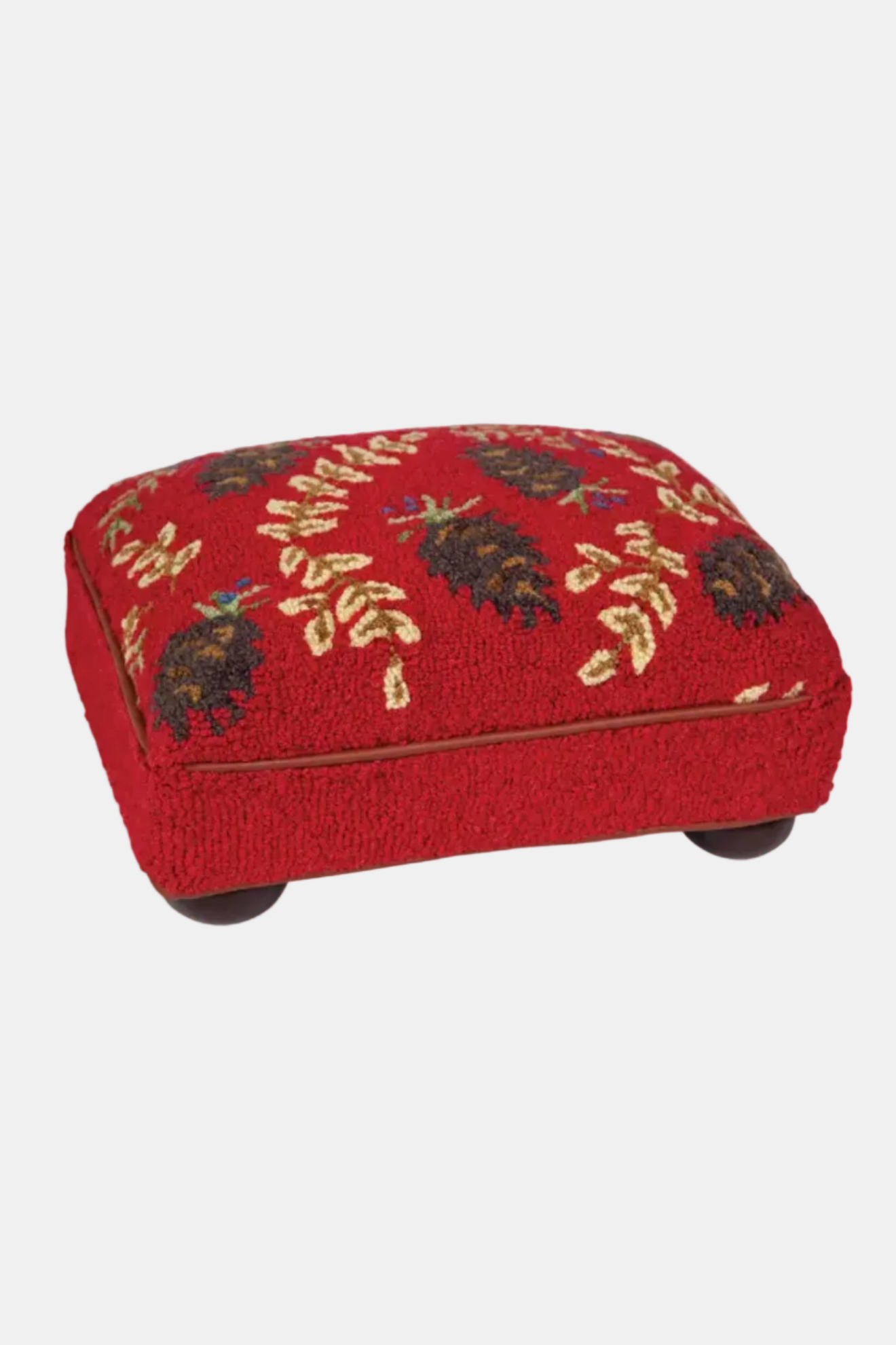 Red ottoman with floral pattern on a white background