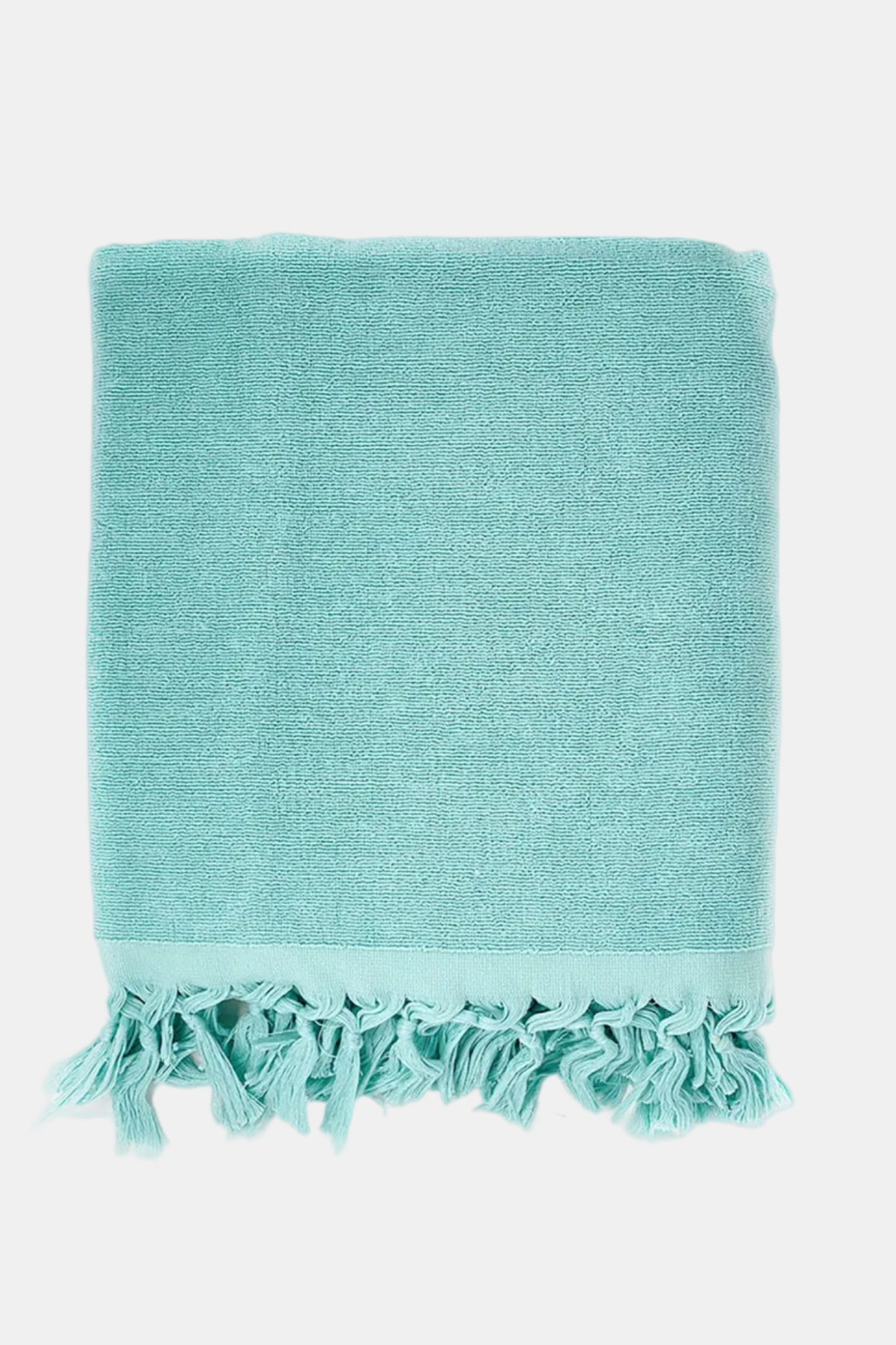 Turquoise towel with tassels on a white background