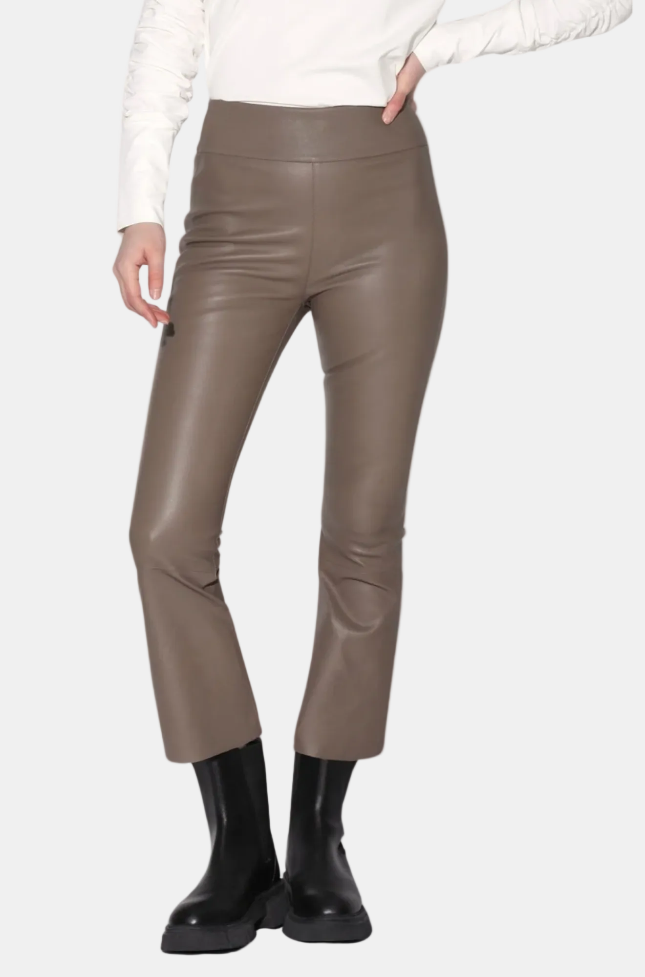 A pair of black Luisa Pant crop flare silhouette leather pants with a model standing against a white background.