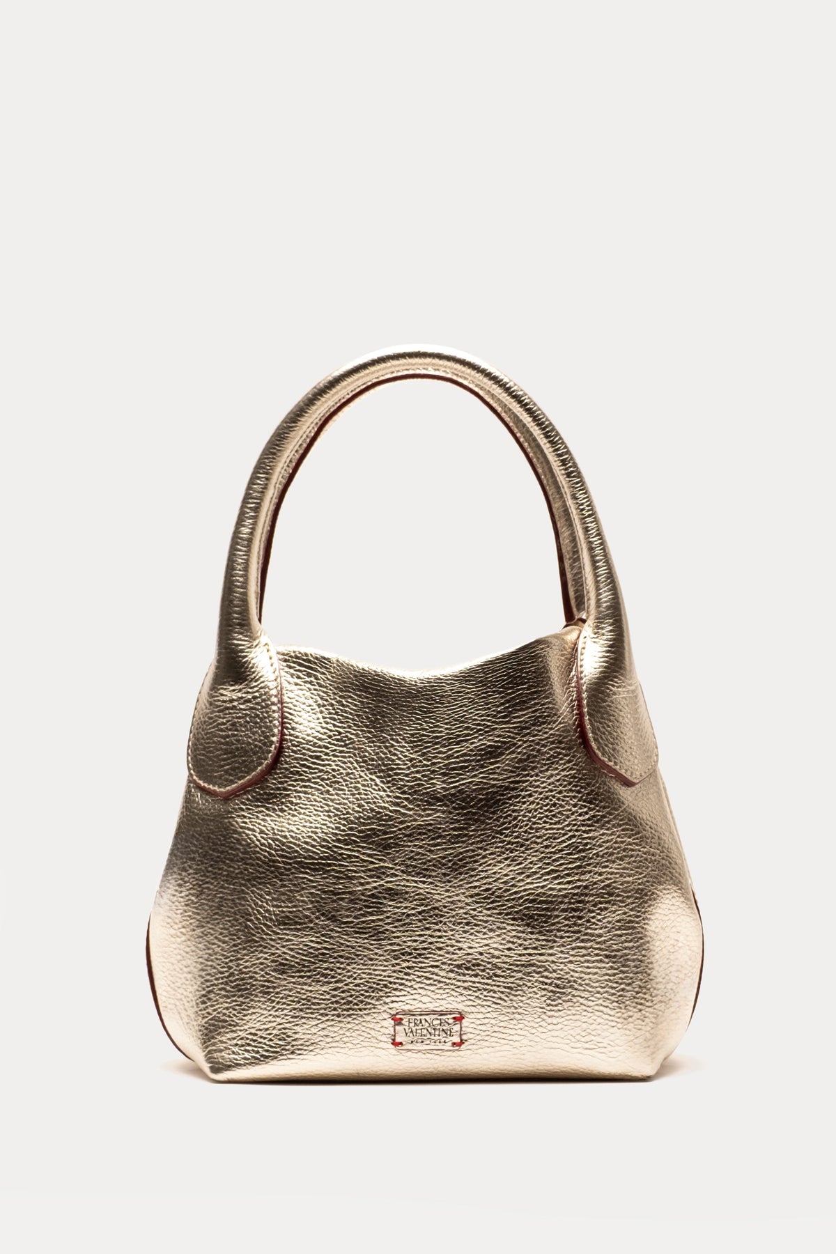 Gold handbag on a light gray background