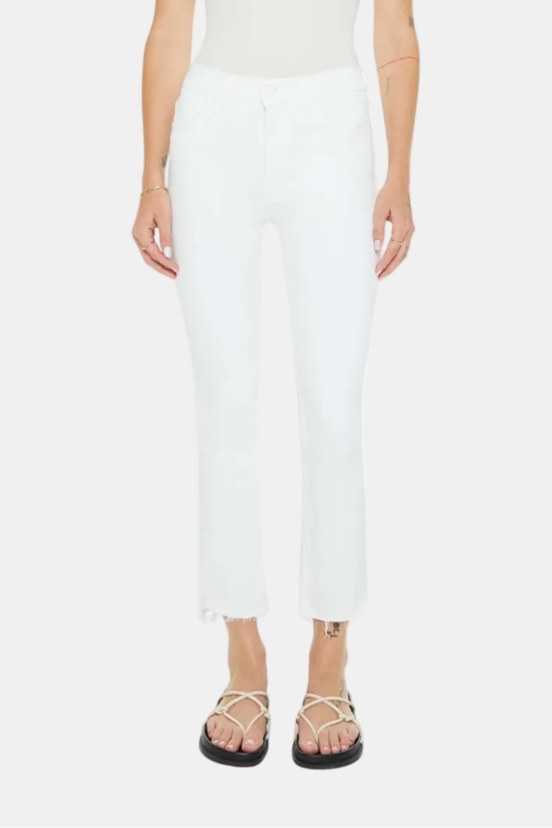 Person wearing a white sleeveless top and pants on a white background