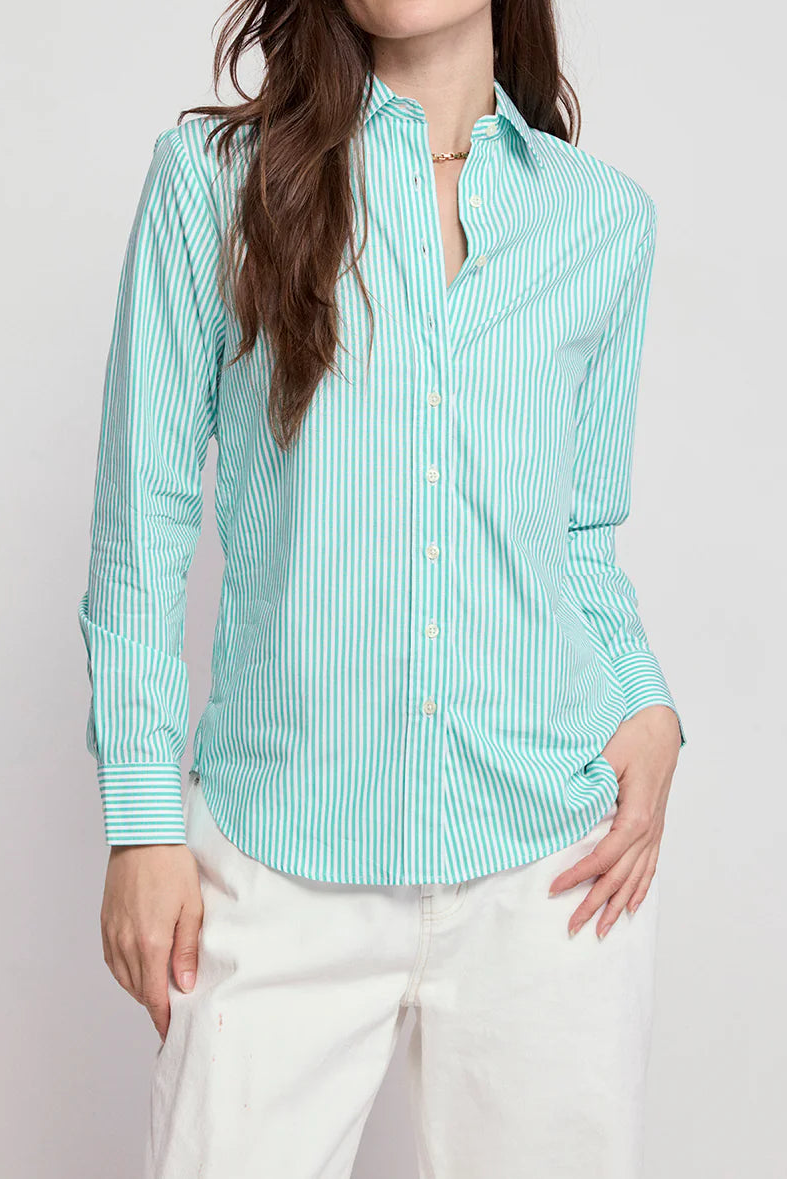 Woman wearing a light blue striped shirt on a white background