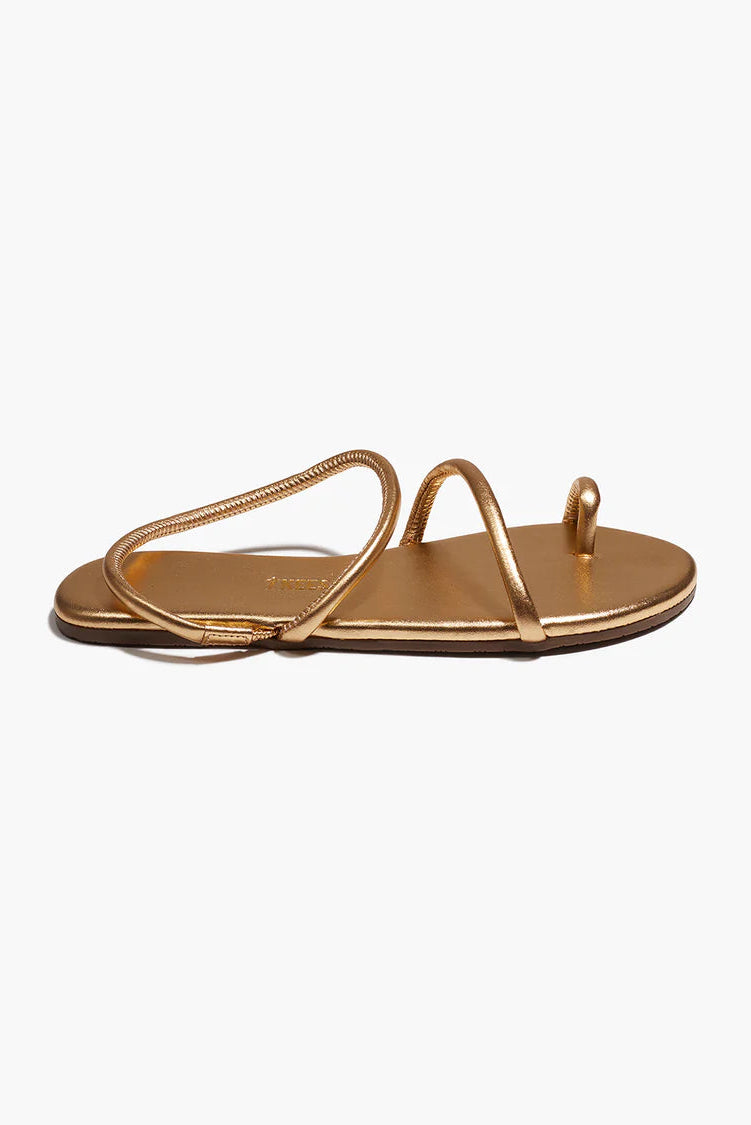 Gold sandal on a white background