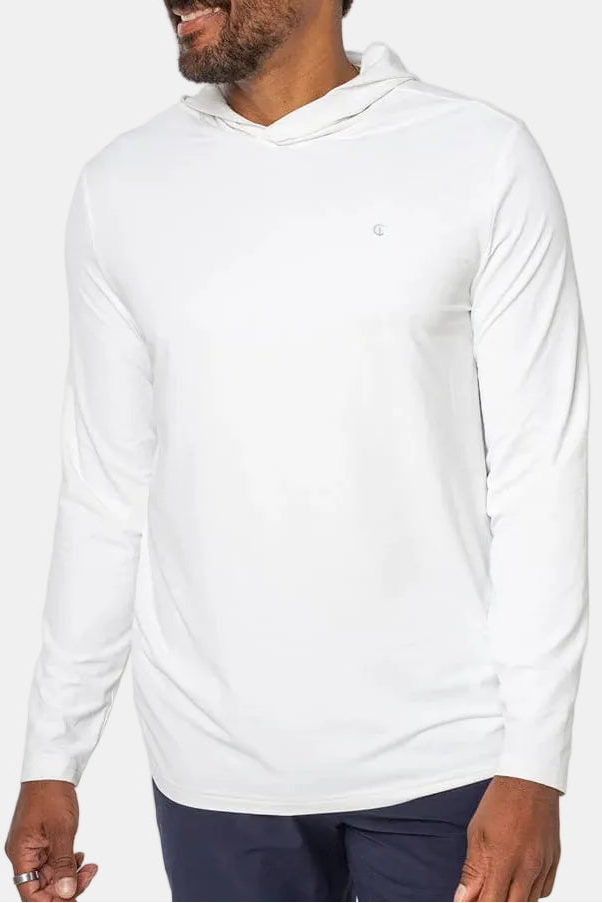 Man wearing a white long-sleeve shirt on a plain background