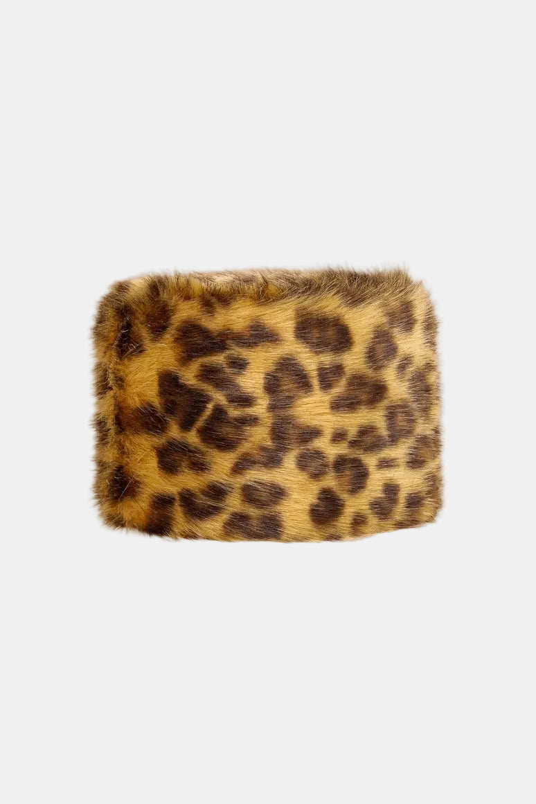 Leopard print fur product on a white background