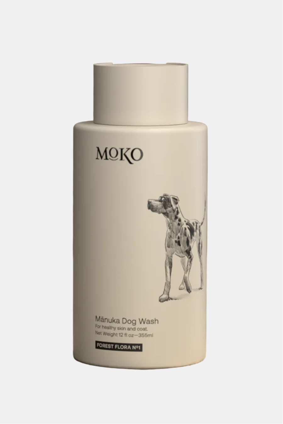MOKO Manuka Dog Wash bottle on a wooden surface with a blurred natural background