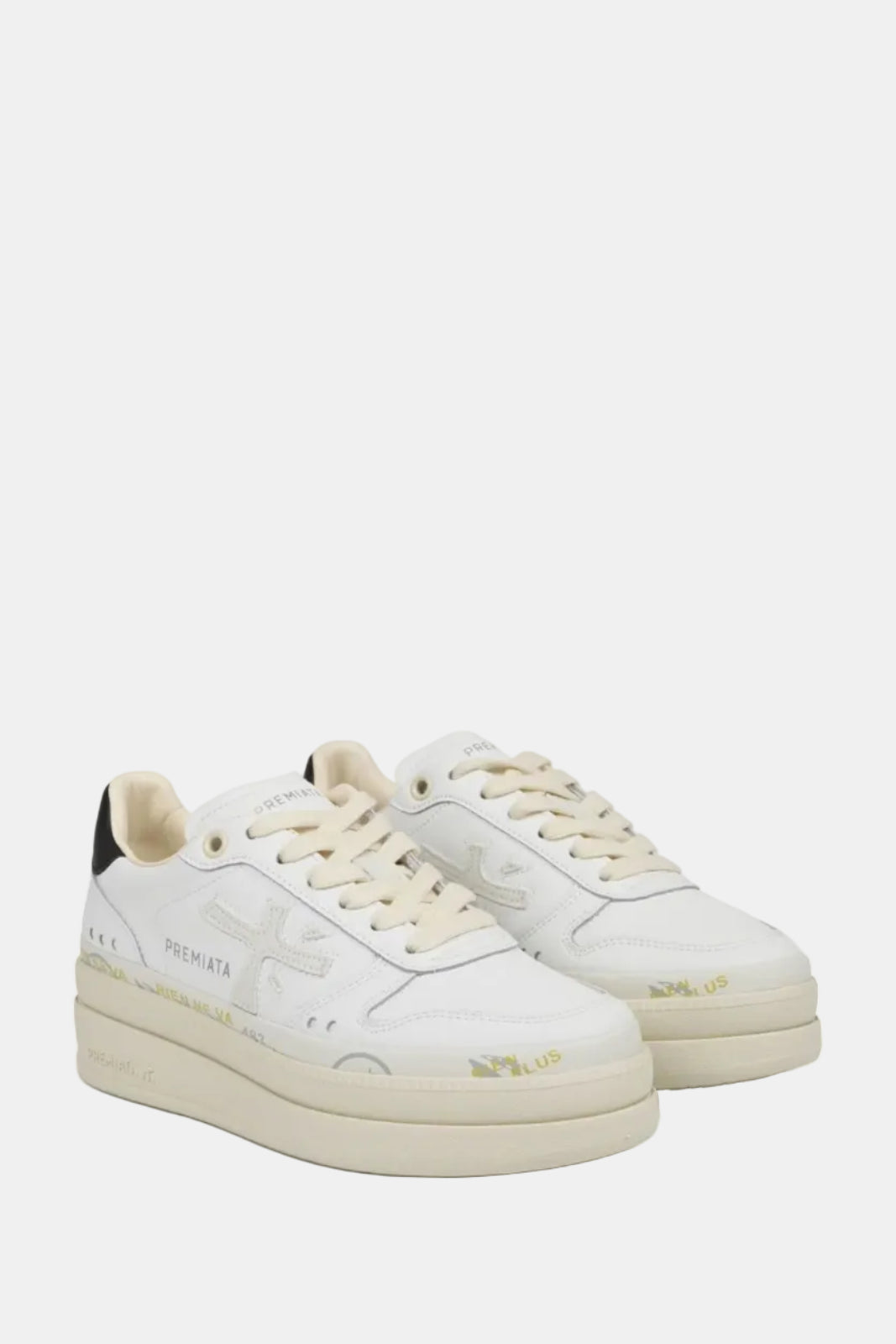 White sneakers with beige accents on a white background