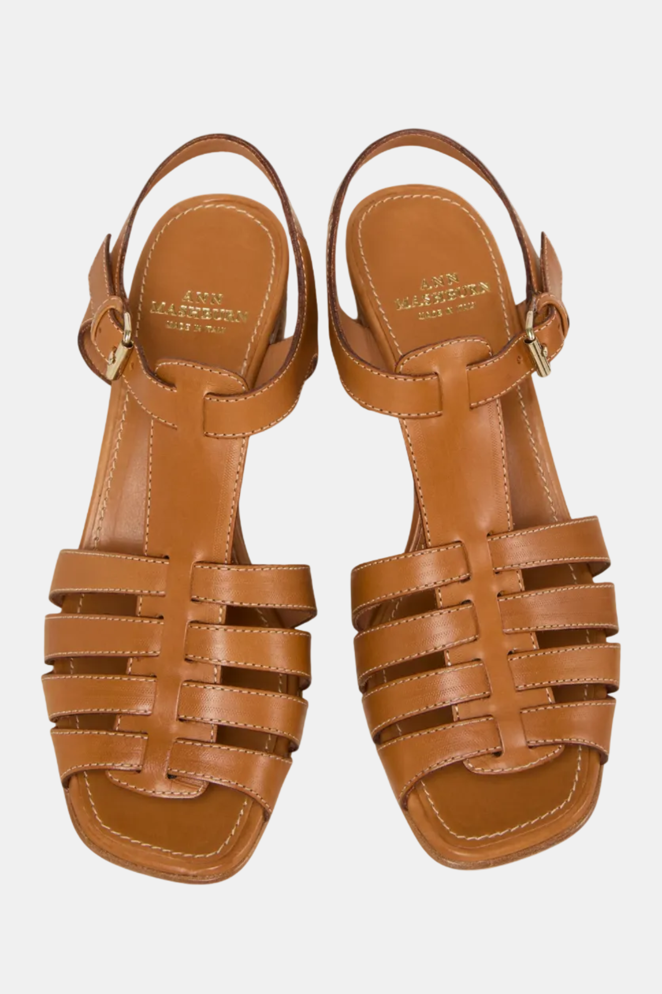A brown open-toe fisherman heel sandal with buckle closure and stacked heel.