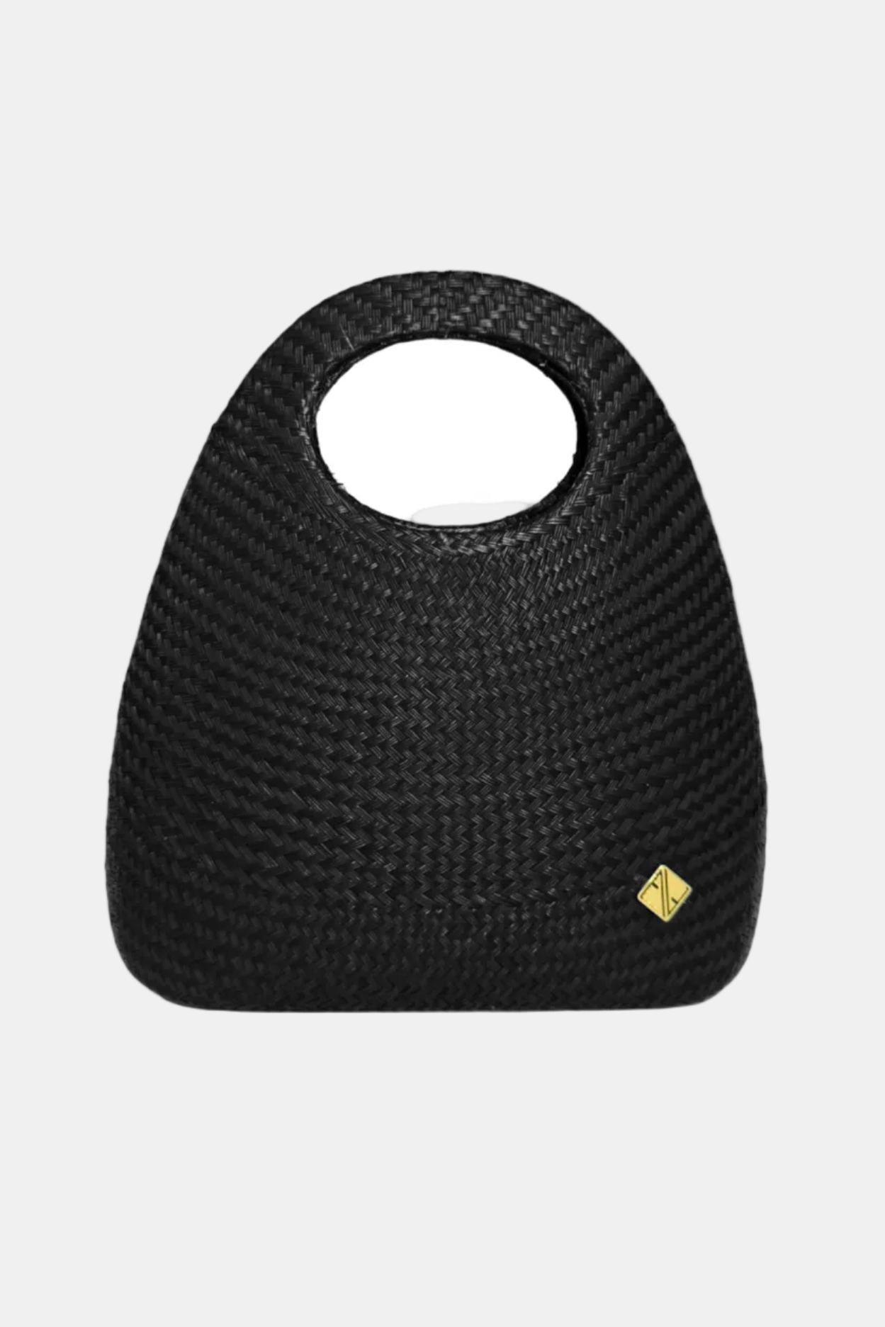 A black handcrafted bag with a round handle and a subtle logo detail in gold.