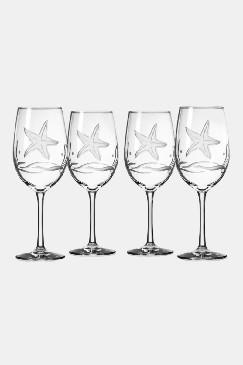 Four wine glasses with starfish design on a white background