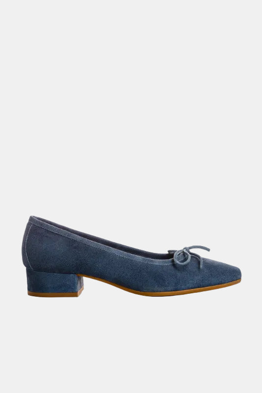 Blue suede shoe with a bow on a white background