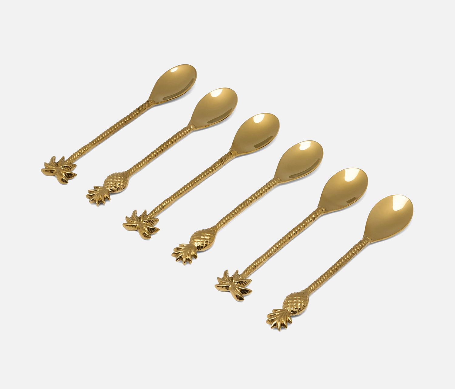 Six gold-colored spoons arranged diagonally on a light gray background. Each spoon has a smooth oval bowl and a textured handle ending in a pineapple design.