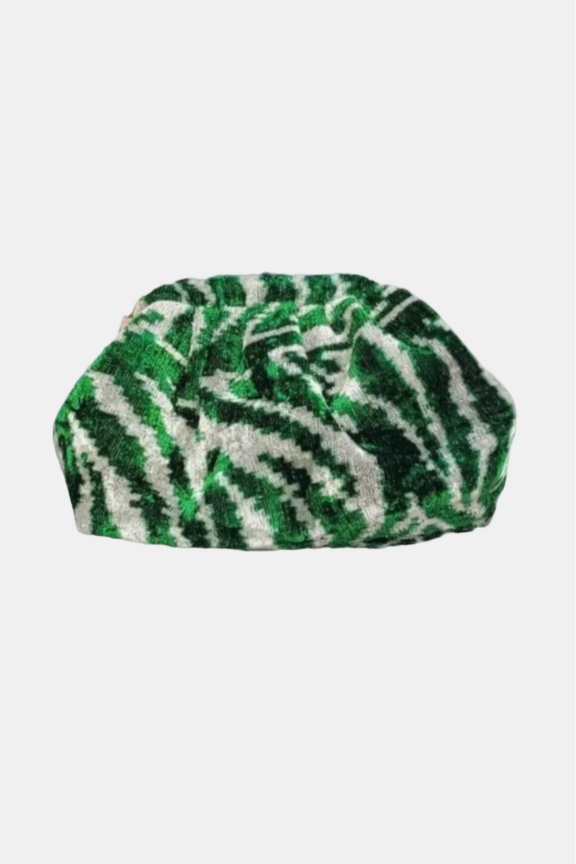 A green and white zebra-patterned textured headwrap or turban cap, shown against a plain white background.