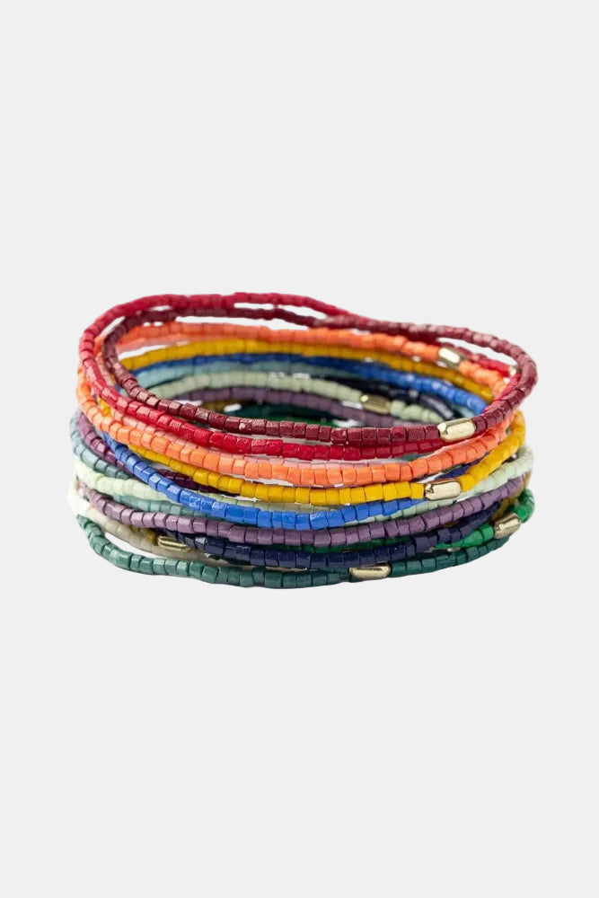 Stack of colorful beaded bracelets on a white background