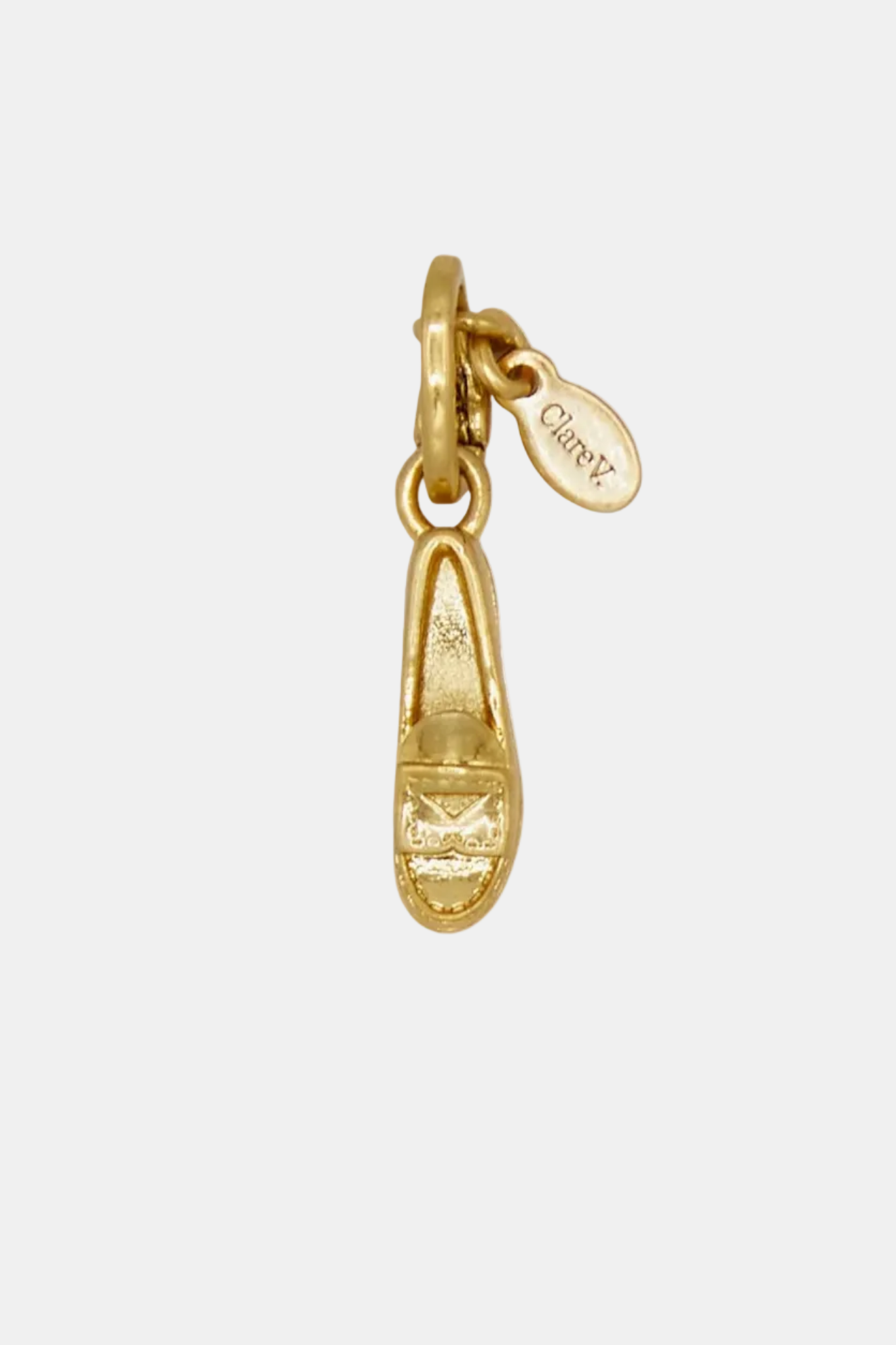 Gold shoe charm with 'Chloe' tag on a white background