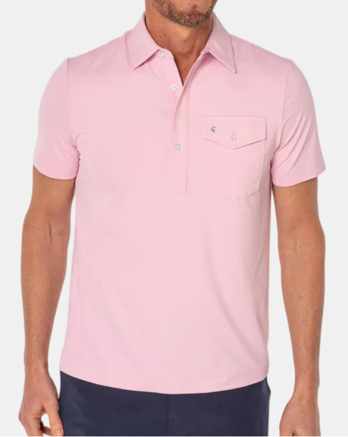 Man wearing a pink polo shirt on a white background