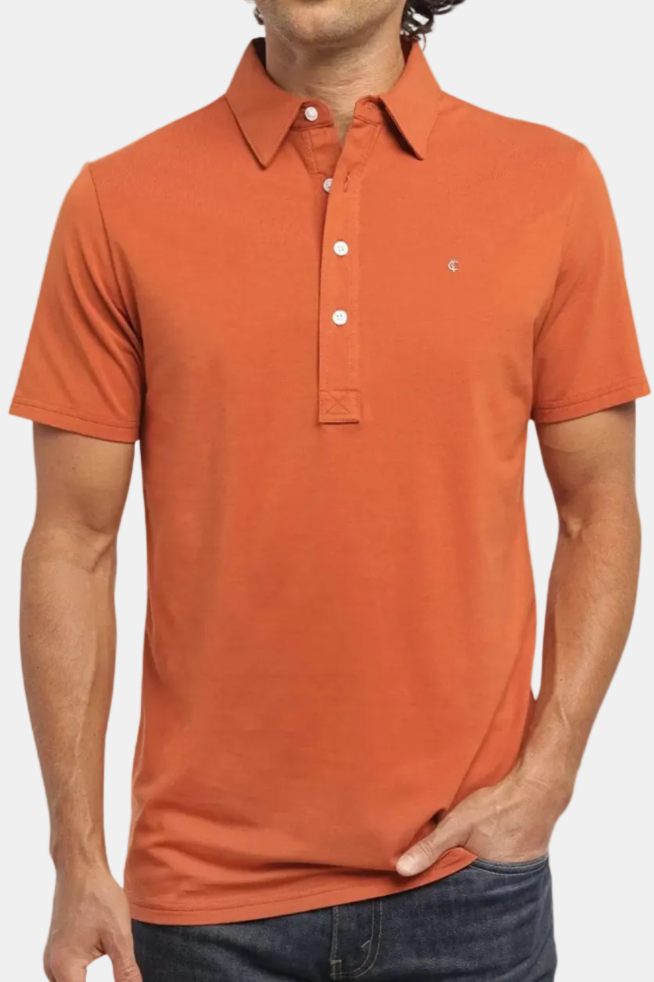 Man wearing an orange polo shirt on a white background