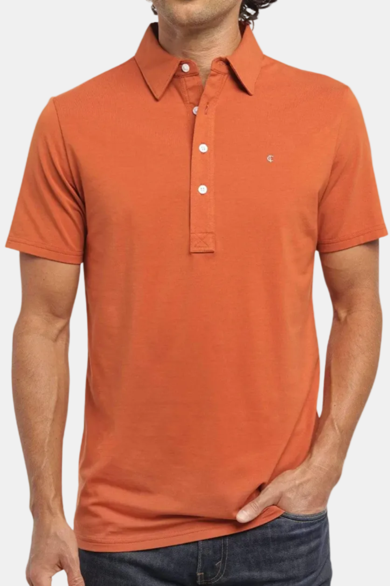 Man wearing an orange polo shirt on a white background