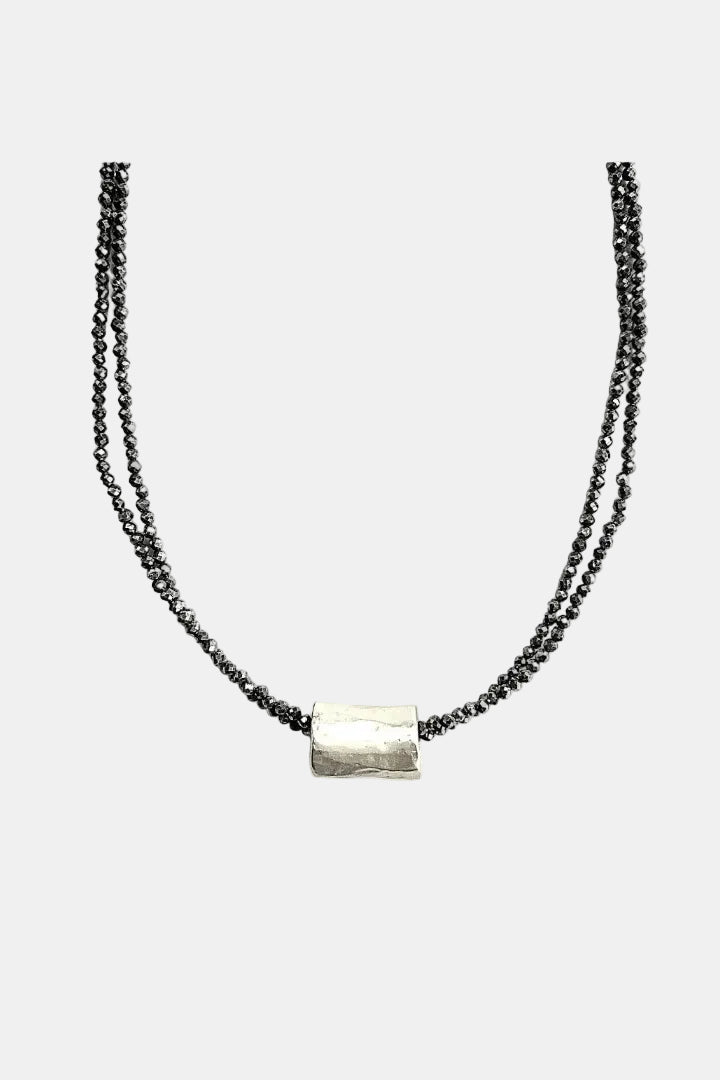 Necklace with a silver bar pendant on a white background