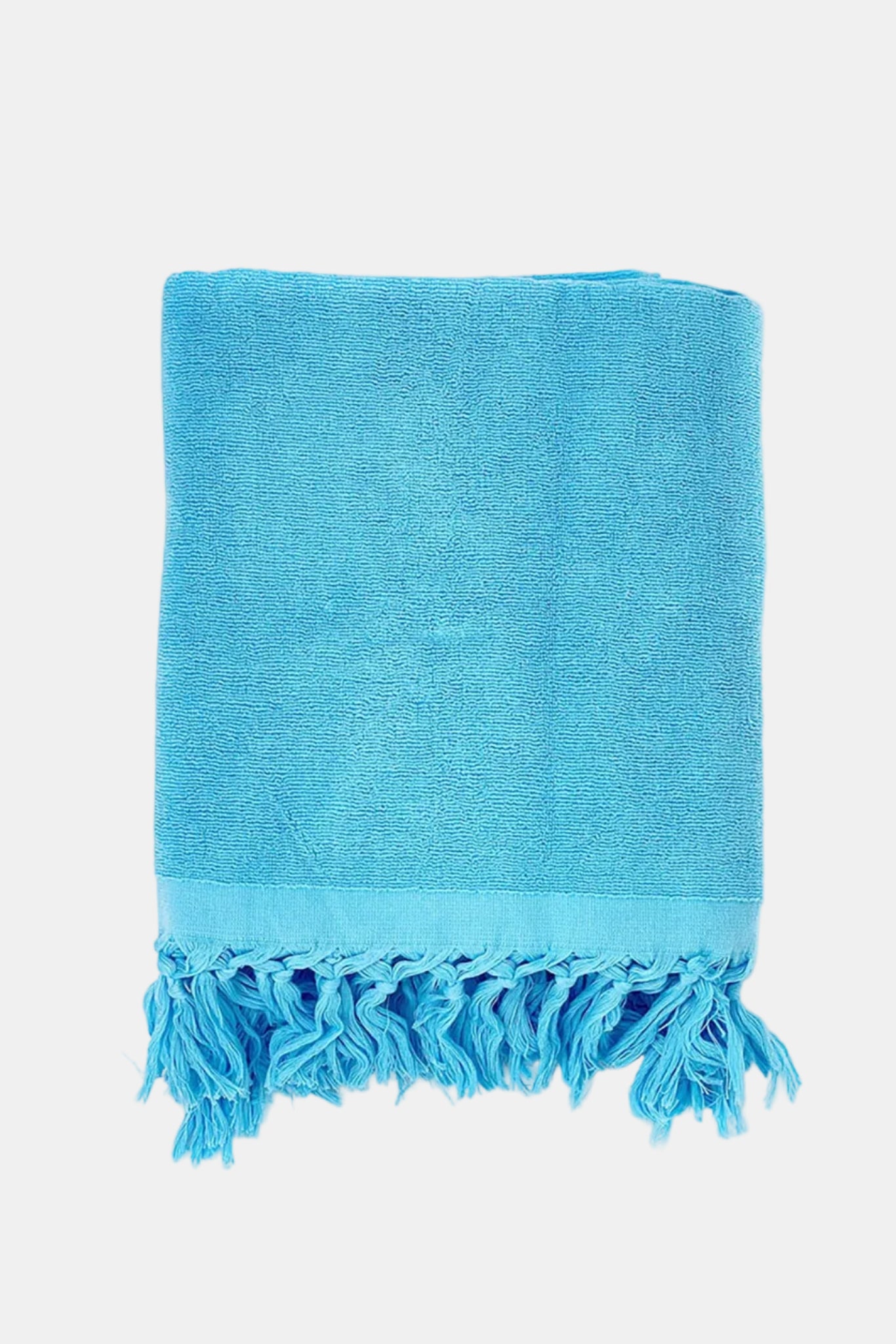 Blue towel with fringes on a white background