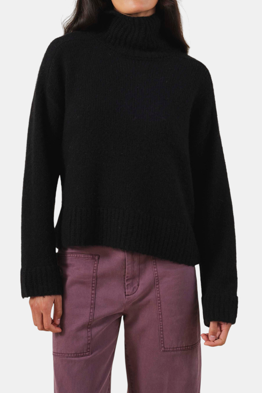 The Copper Shed black cashmere blend turtleneck sweater with a relaxed fit and ribbed trim.