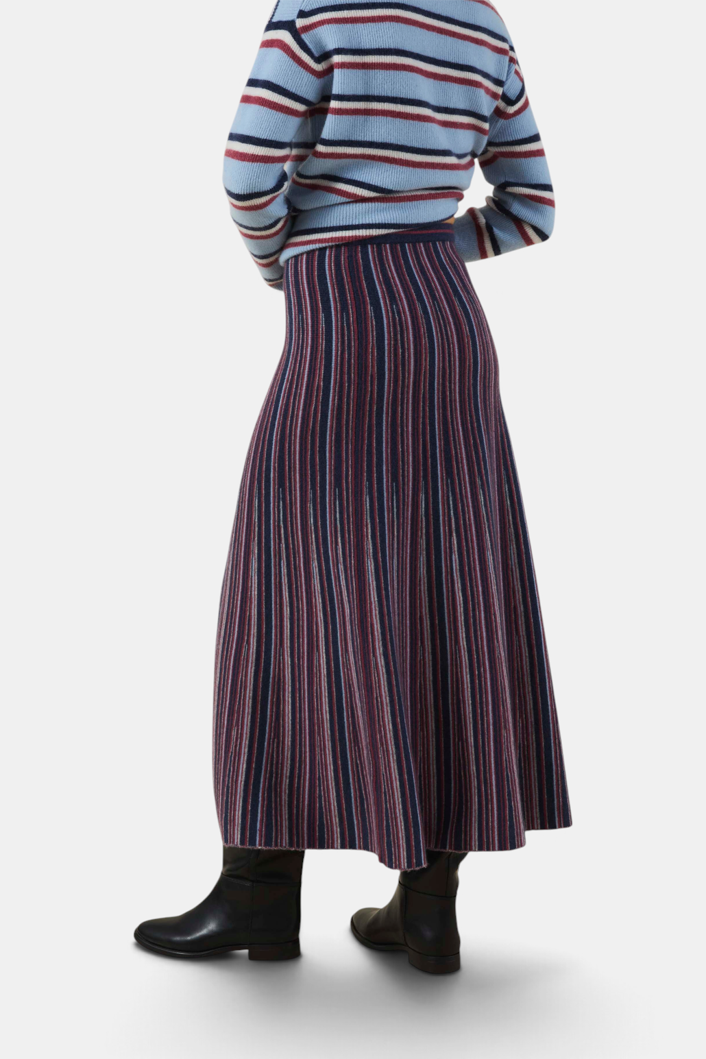 The Copper Shed Desiree08 midi skirt in a navy and burgundy vertical striped knit fabric, shown from the back.
